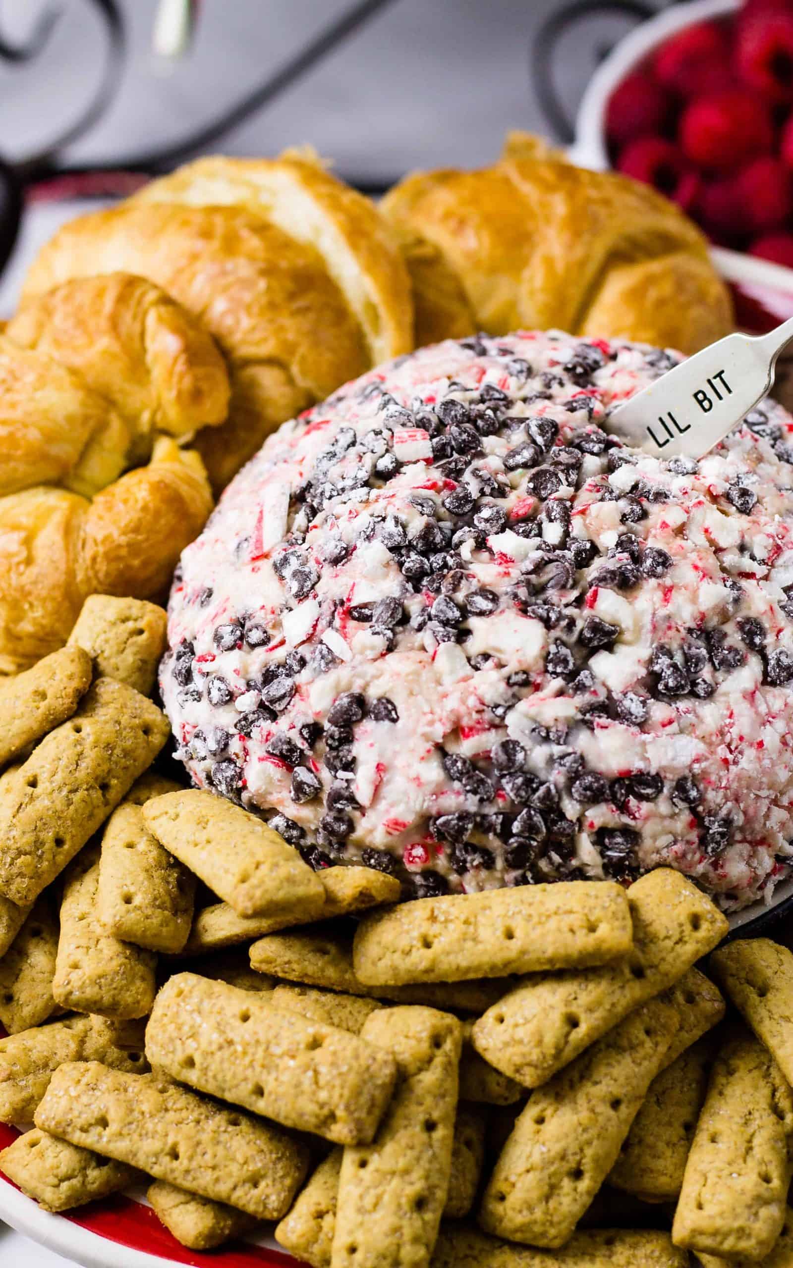 Peppermint Mocha cheese ball with cookies and croissants on a platter
