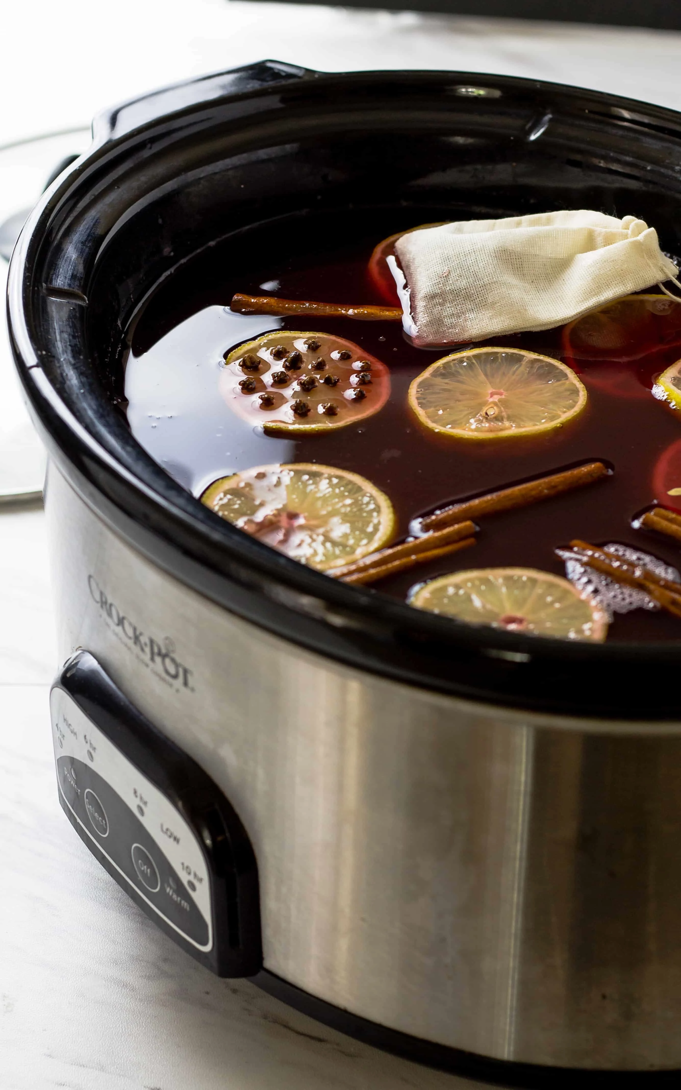 Crockpot Wassail Winter Punch cooking in the crock pot