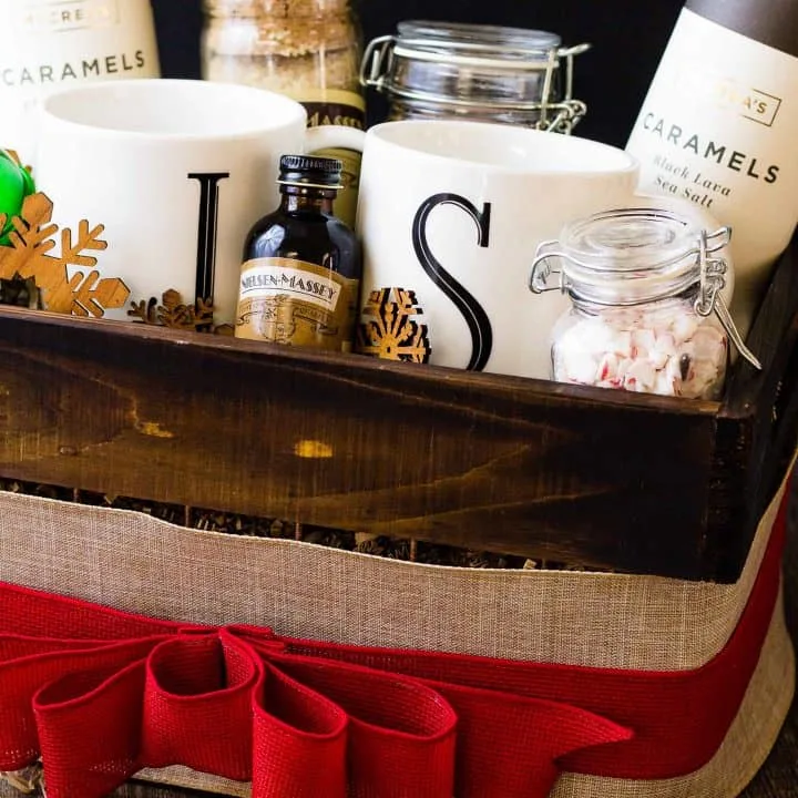 Side view of full gift basket with a big red bow around it.