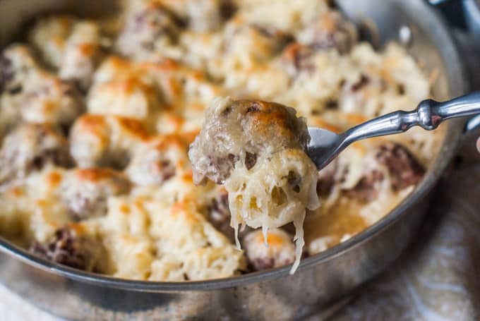 Reuben Meatballs in a skillet and one on a fork