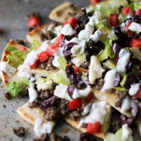 Close up of Greek Gyro Nachos on a sheet pan