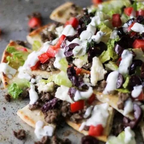 Close up of Greek Gyro Nachos on a sheet pan