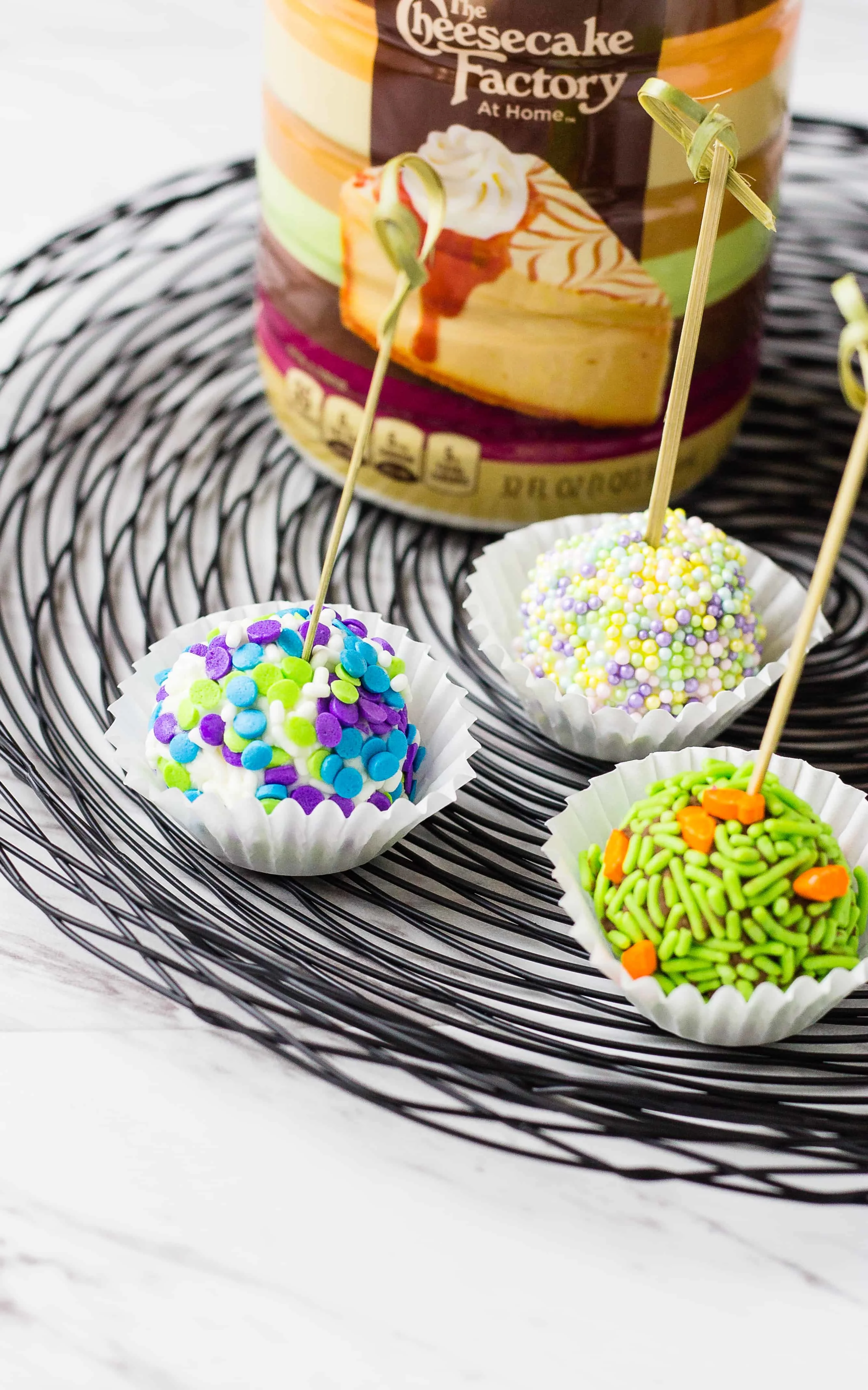 no-bake cheesecake bites in mini cupcake liners on a wire platter