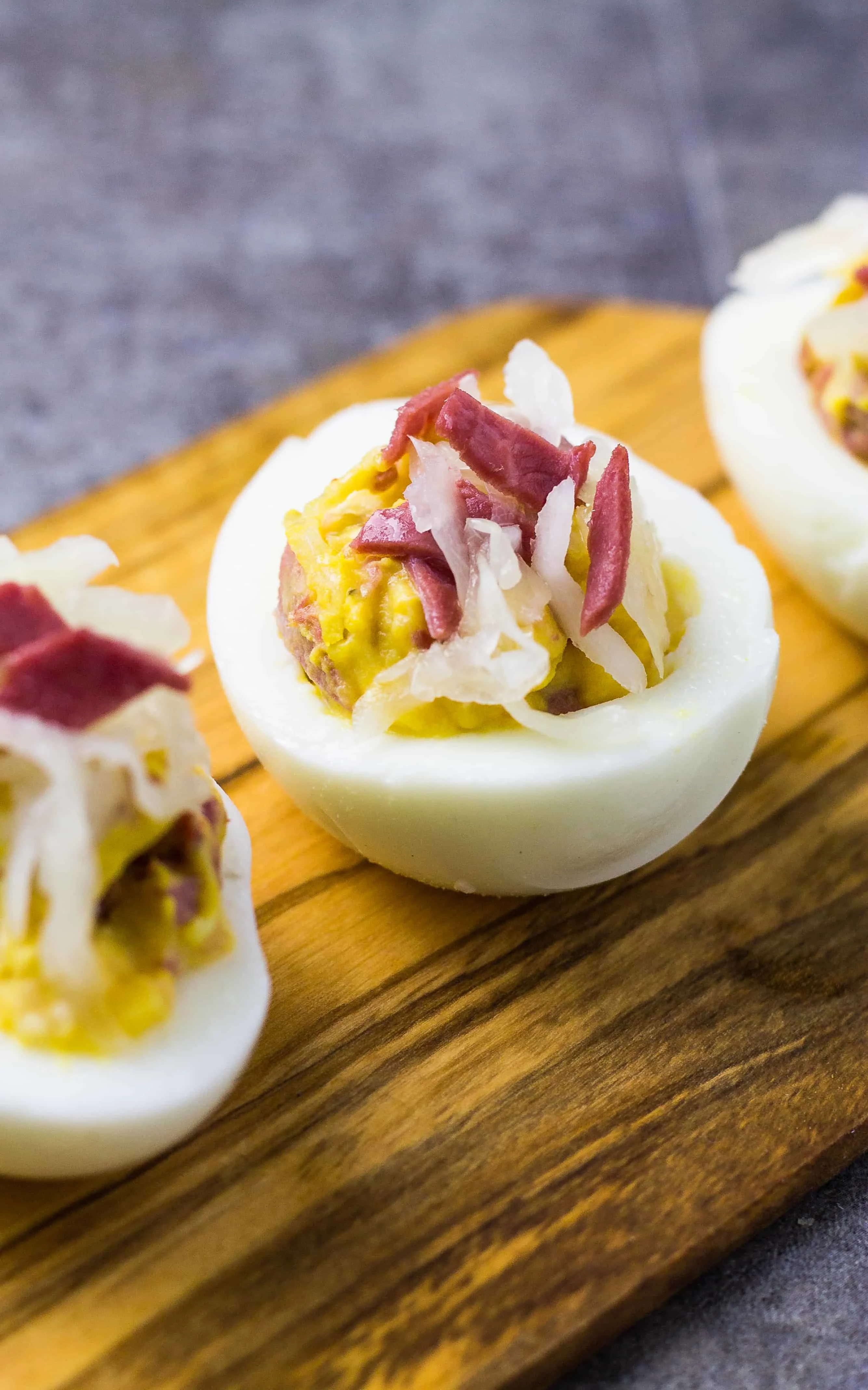 corned beef reuben deviled egg on wood tray