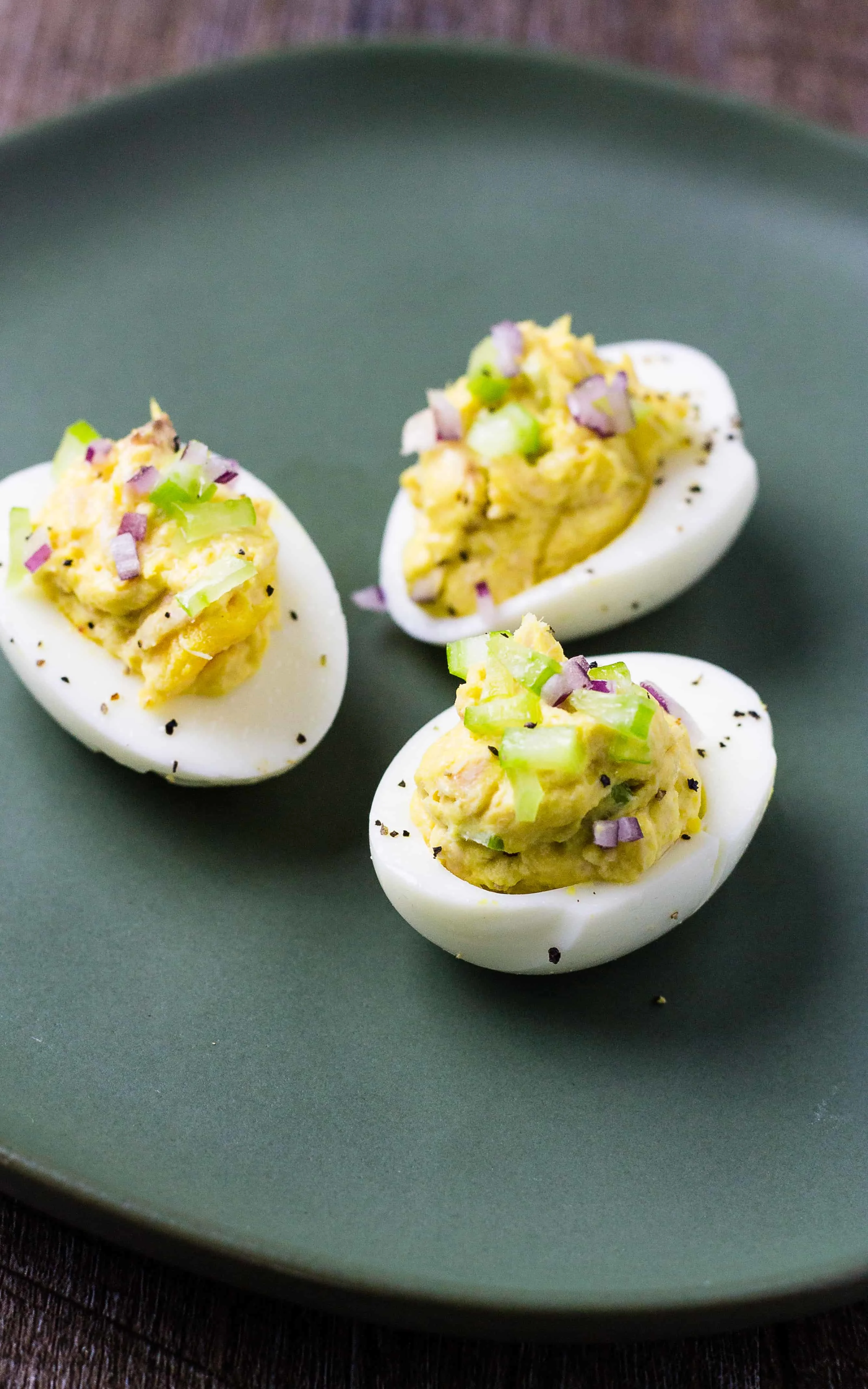 Close up of Tuna Salad eggs on a green plate