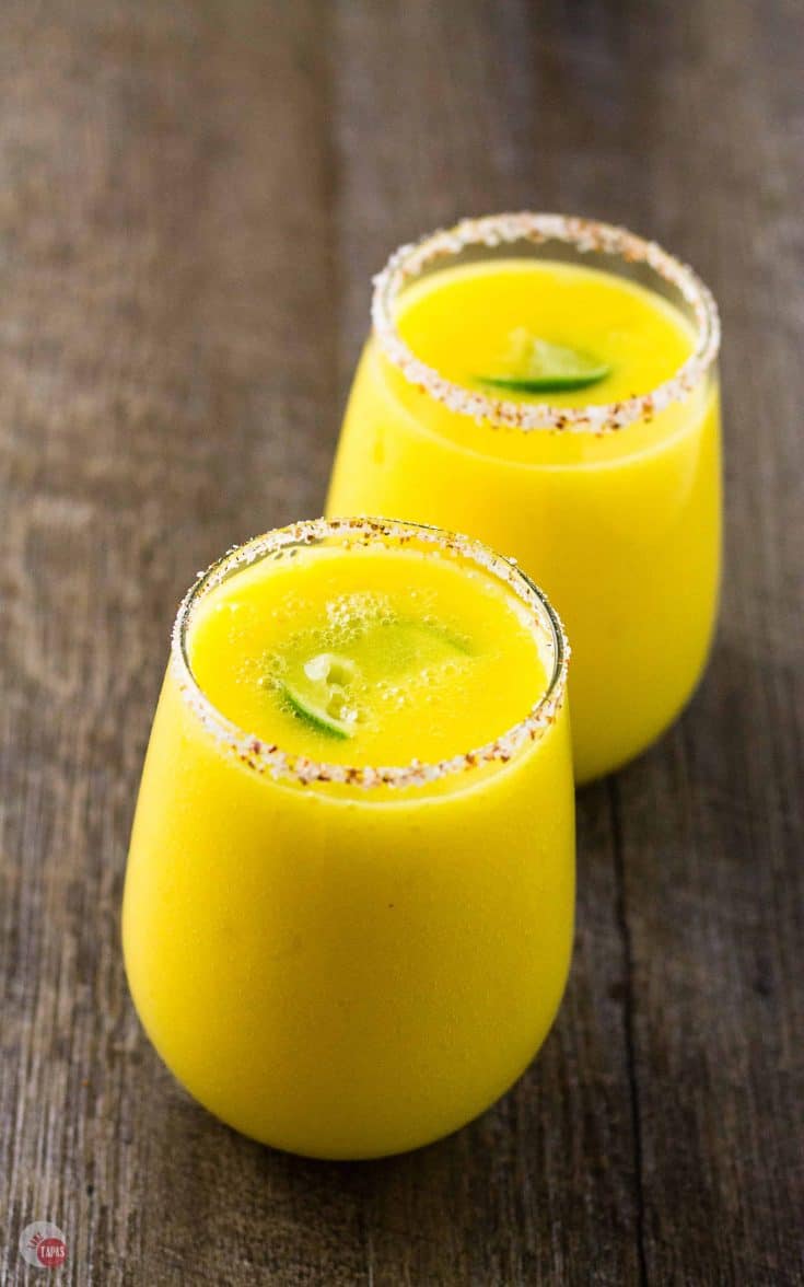 Mango Margarita with a Spicy Tajín Seasoning Salt Rim Mango Margarita with a Spicy Tajín Seasoning Salt Rim
