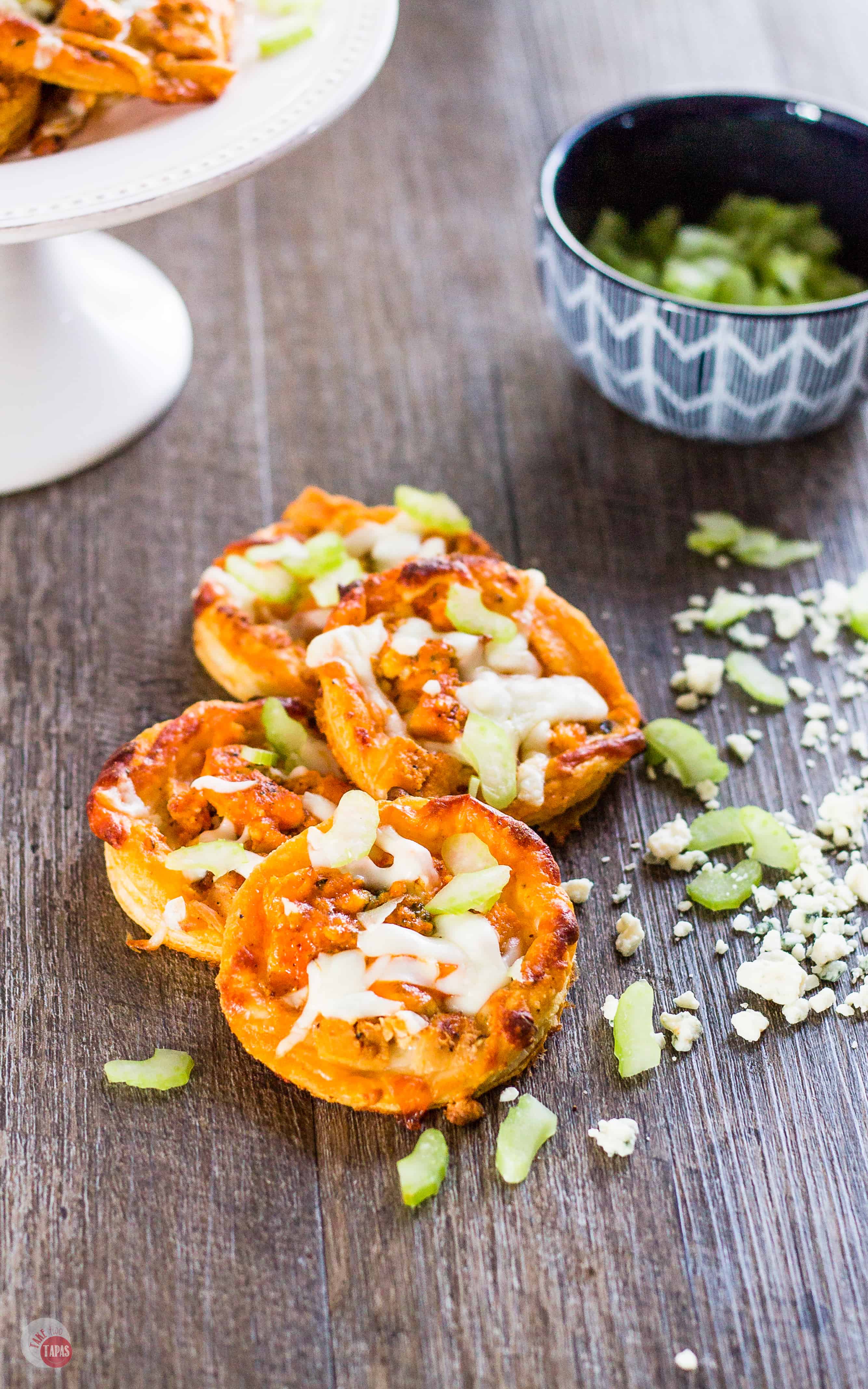 Buffalo sauce and blue cheese on Puff Pastry make a great BBQ Buffalo Chicken Tart mini pizza | Take Two Tapas | #BuffaloChicken #pizza #tart #BlueCheese #HotSauce #GameDayRecipes #Appetizers #PuffPastry