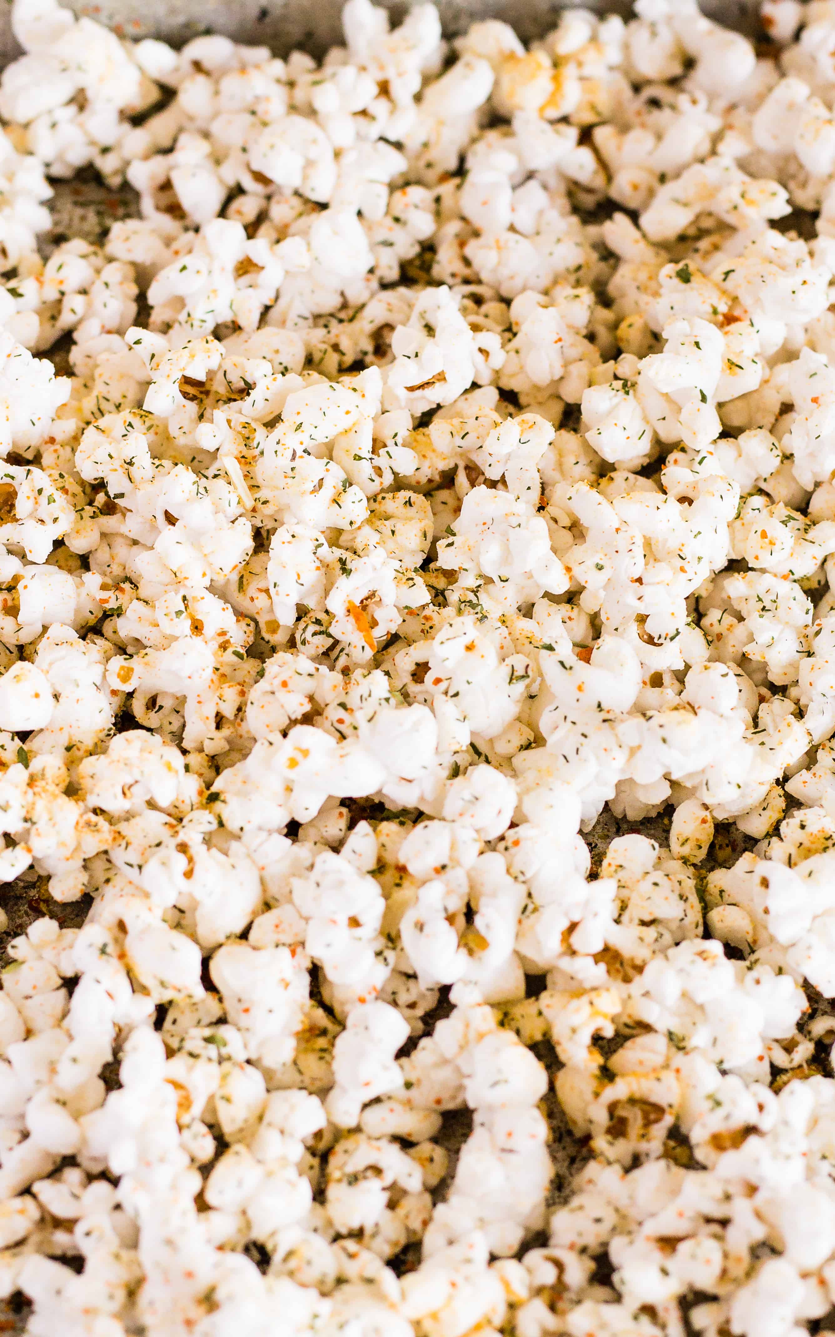 Spread out the popcorn for maximum coverage with the Buffalo Ranch Seasoning | Take Two Tapas | #BuffaloRanch #PopcornRecipes #HealthyPopcornRecipes #HotSauce #BuffaloRanchPopcorn