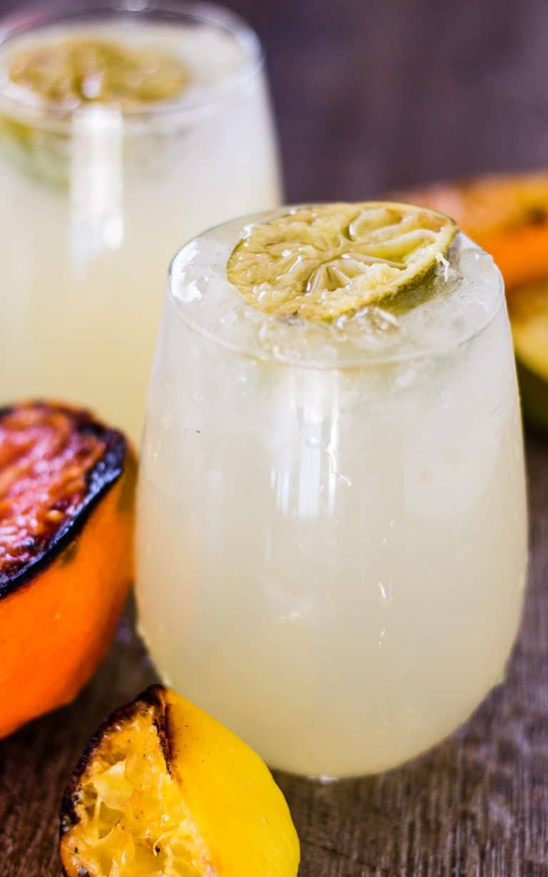 Side view of Smoky and Sweet Caramelized Citrus Smash cocktails