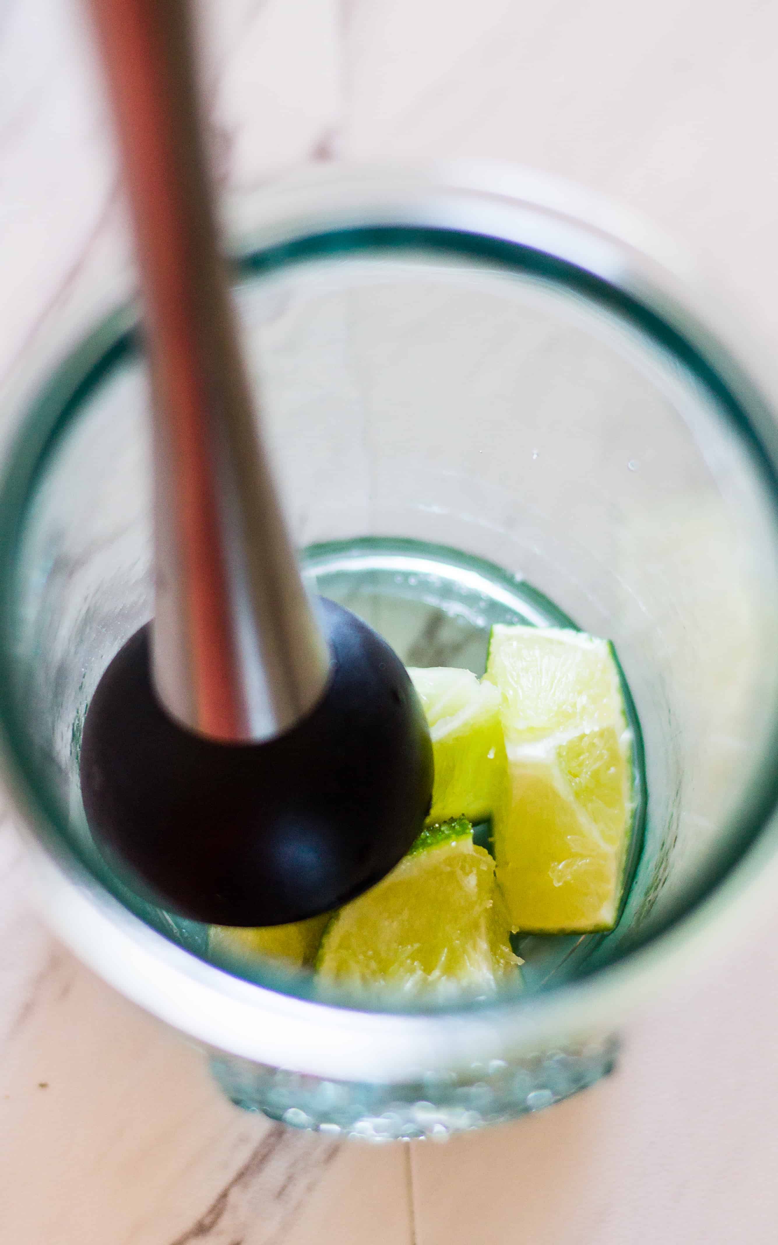 The sugar helps to juice the limes in this Spicy Jalapeño Caipirinha Cocktail