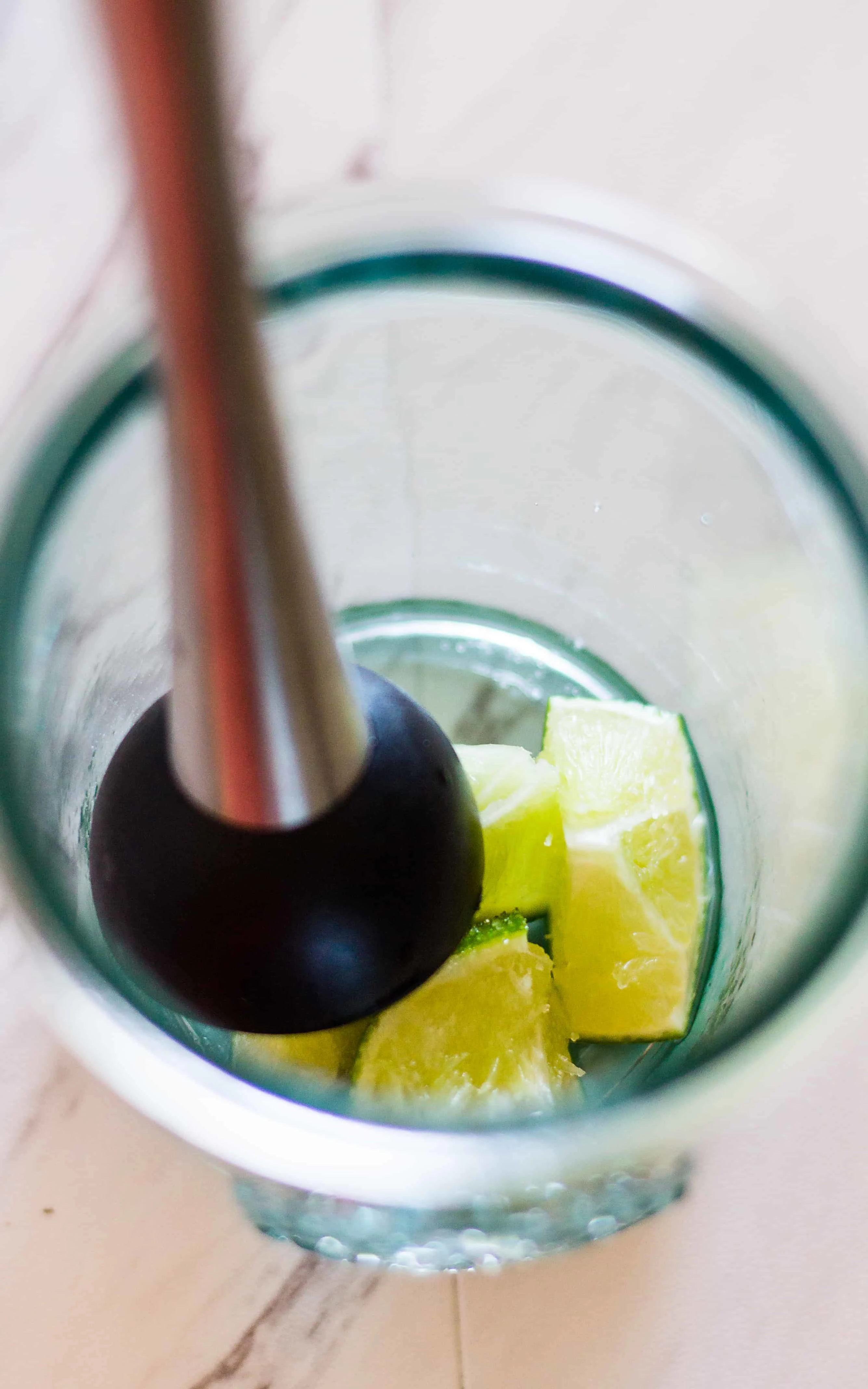 The sugar helps to juice the limes in this Spicy Jalapeño Caipirinha Cocktail