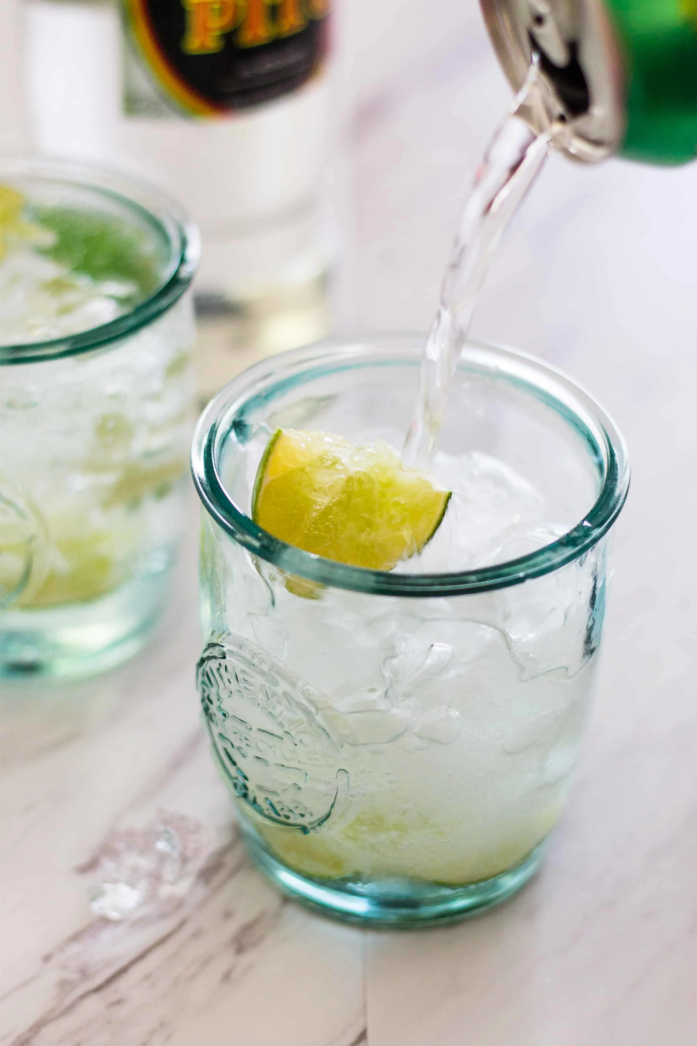 Lime Sparkling water helps to tame the jalapeño in this Caipirinha Cocktail 
