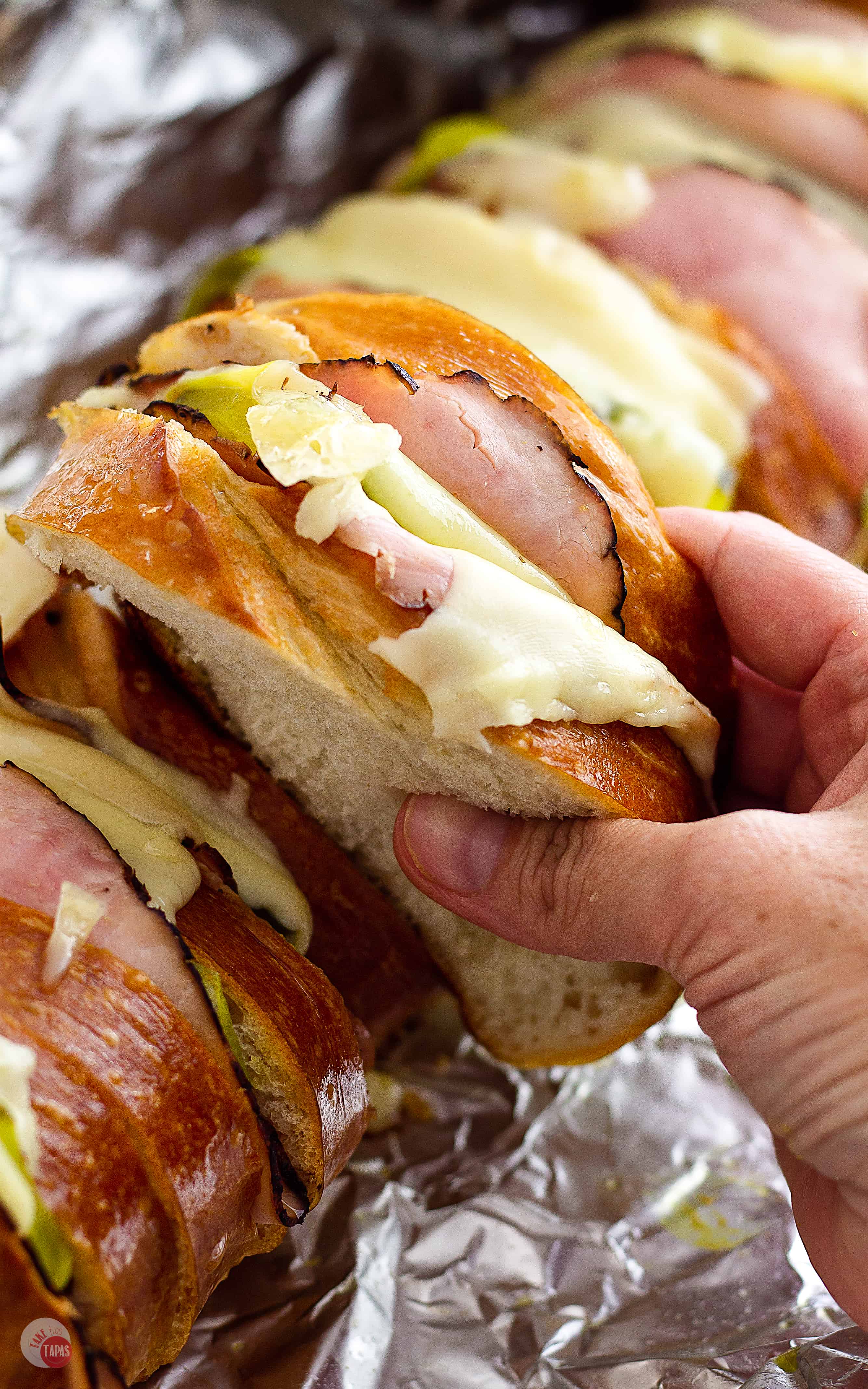 Cooked all at once this Cuban Sandwich Loaf for a Crowd is perfect! - Tailgating Sandwiches