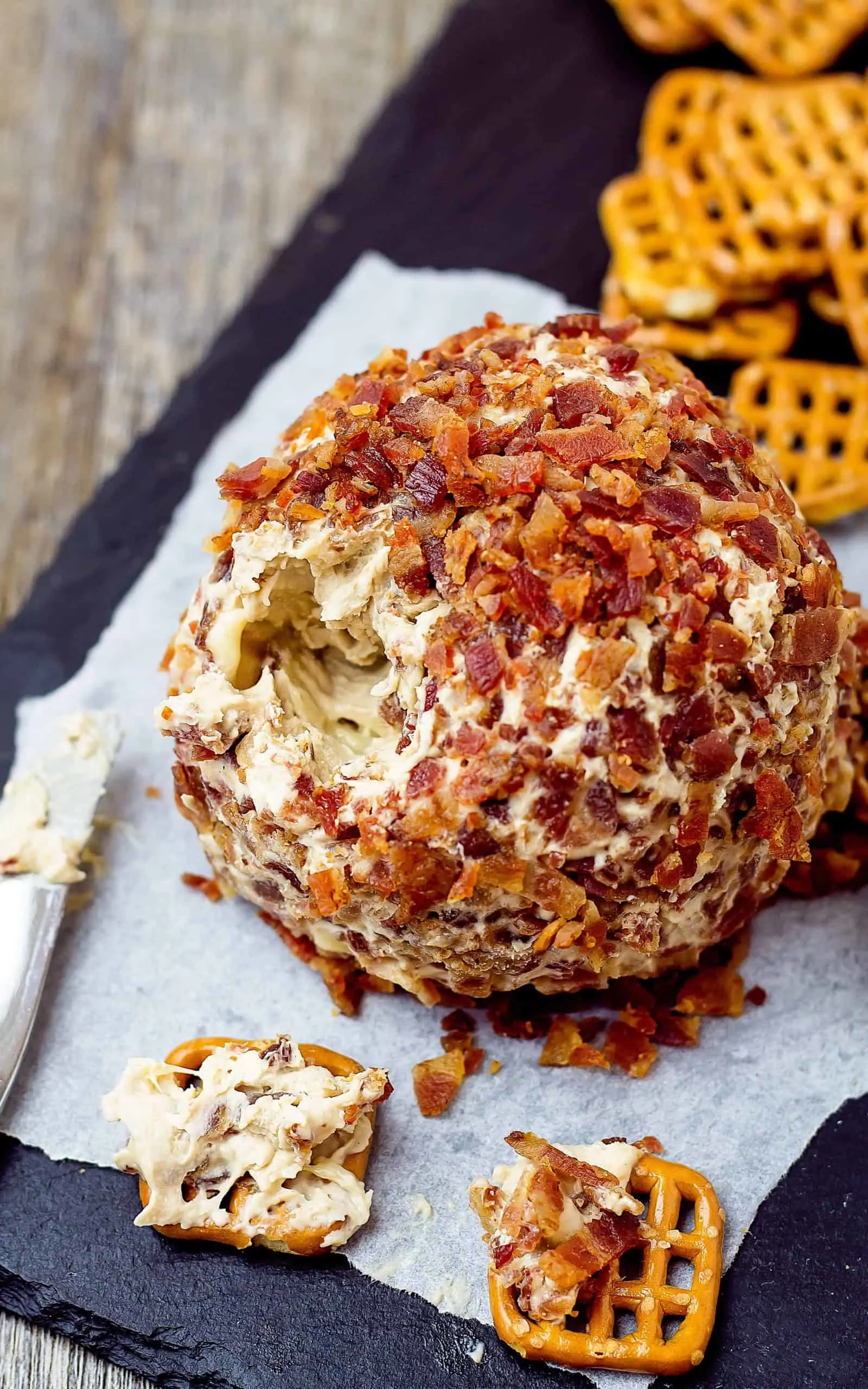 close up of Elvis Cheese Ball and a few dipped pretzels