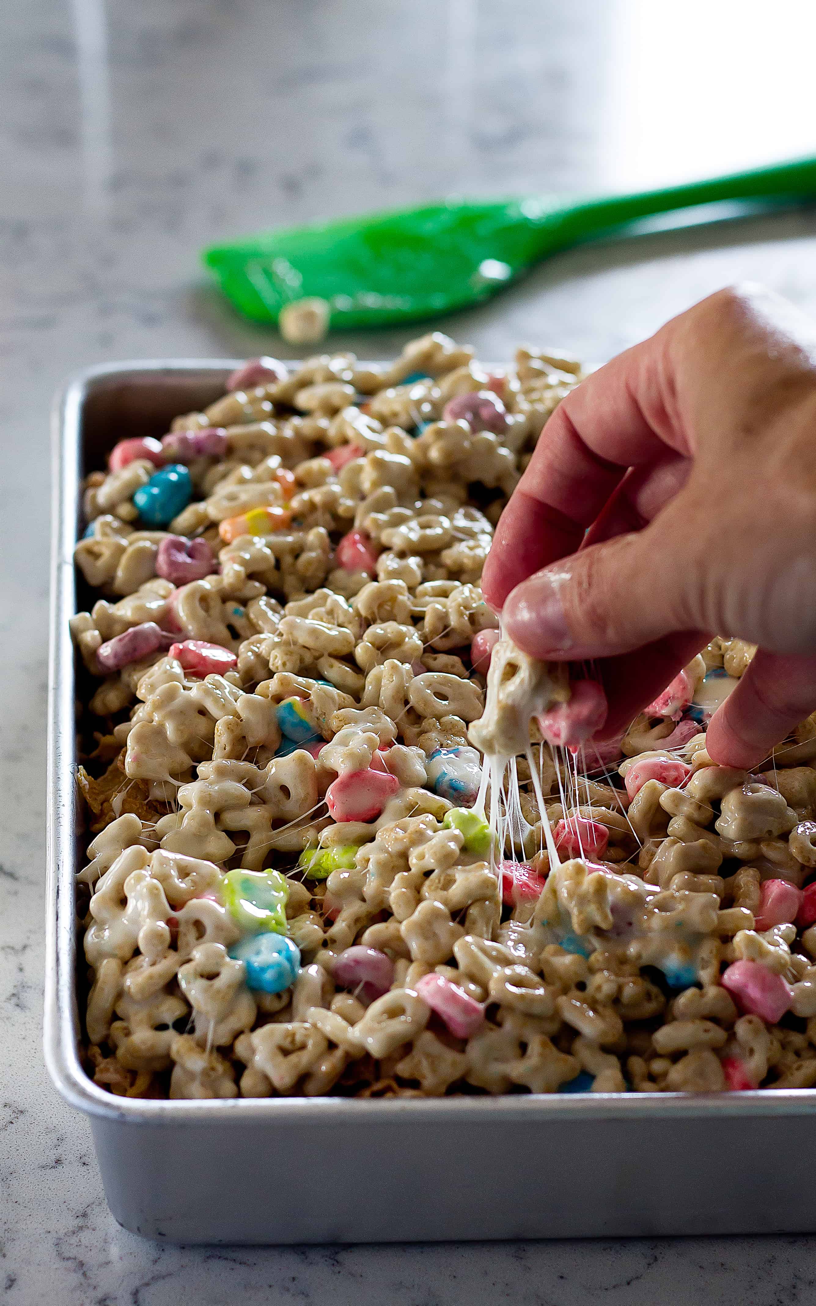 3 layers of your favorite cereals make these Layered Cereal Treat Bars the best! | Take Two Tapas | #CerealBars #KrispiesTreats #FruitLoops #FrostedFlakes #LuckyCharms #CerealRecipes #KidsTreats #AfterSchoolSnacks