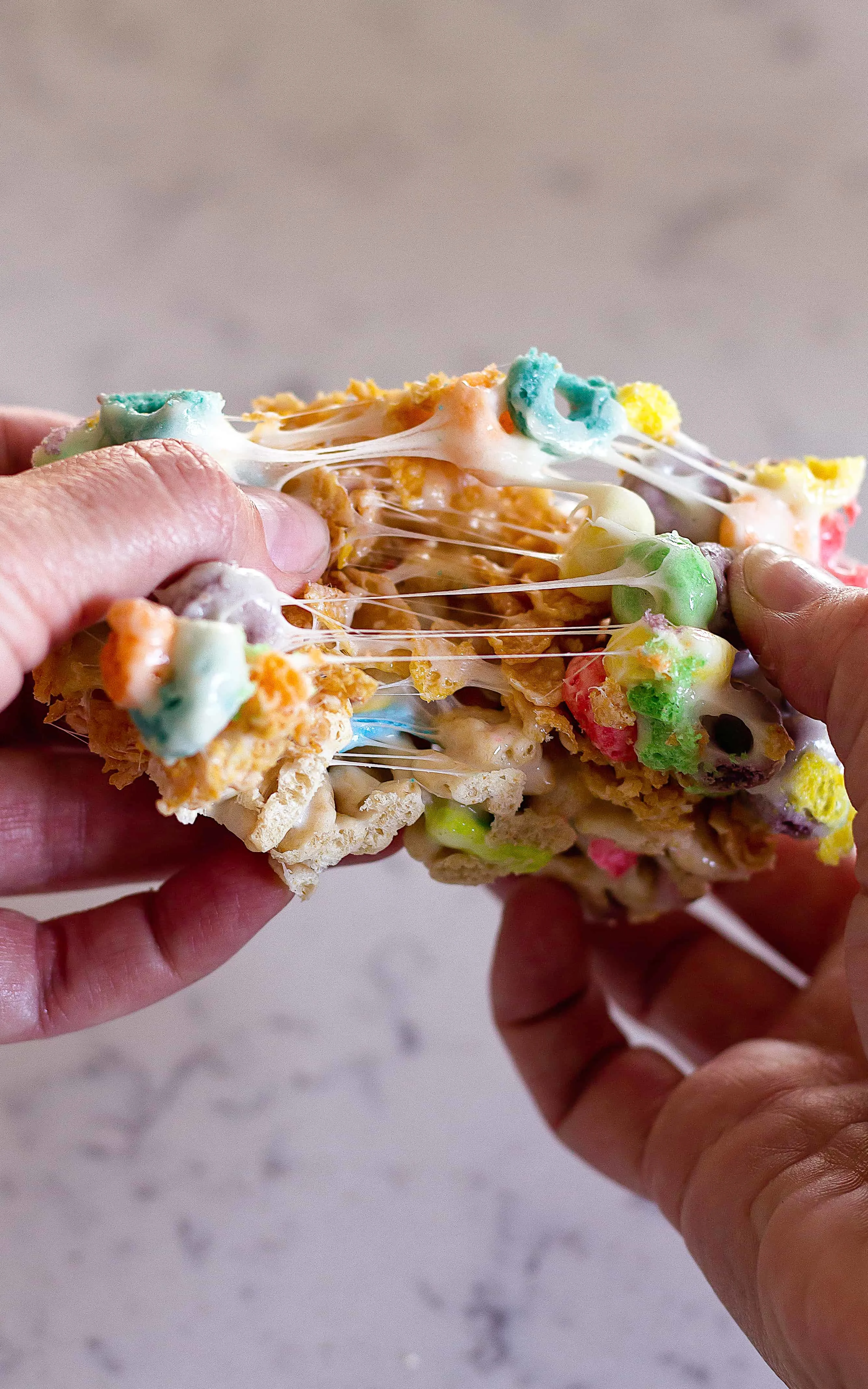 Check out the chewy marshmallow in my Layered Cereal Bars | Take Two Tapas | #CerealBars #KrispiesTreats #FruitLoops #FrostedFlakes #LuckyCharms #CerealRecipes #KidsTreats #AfterSchoolSnacks