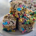 A smaller deeper pan works best to showcase the layers of cereal! Layered Cereal Treat Bars | Take Two Tapas | #CerealBars #RiceKrispiesTreats #FruitLoops #FrostedFlakes #LuckyCharms #CerealRecipes #KidsTreats #AfterSchoolSnacks