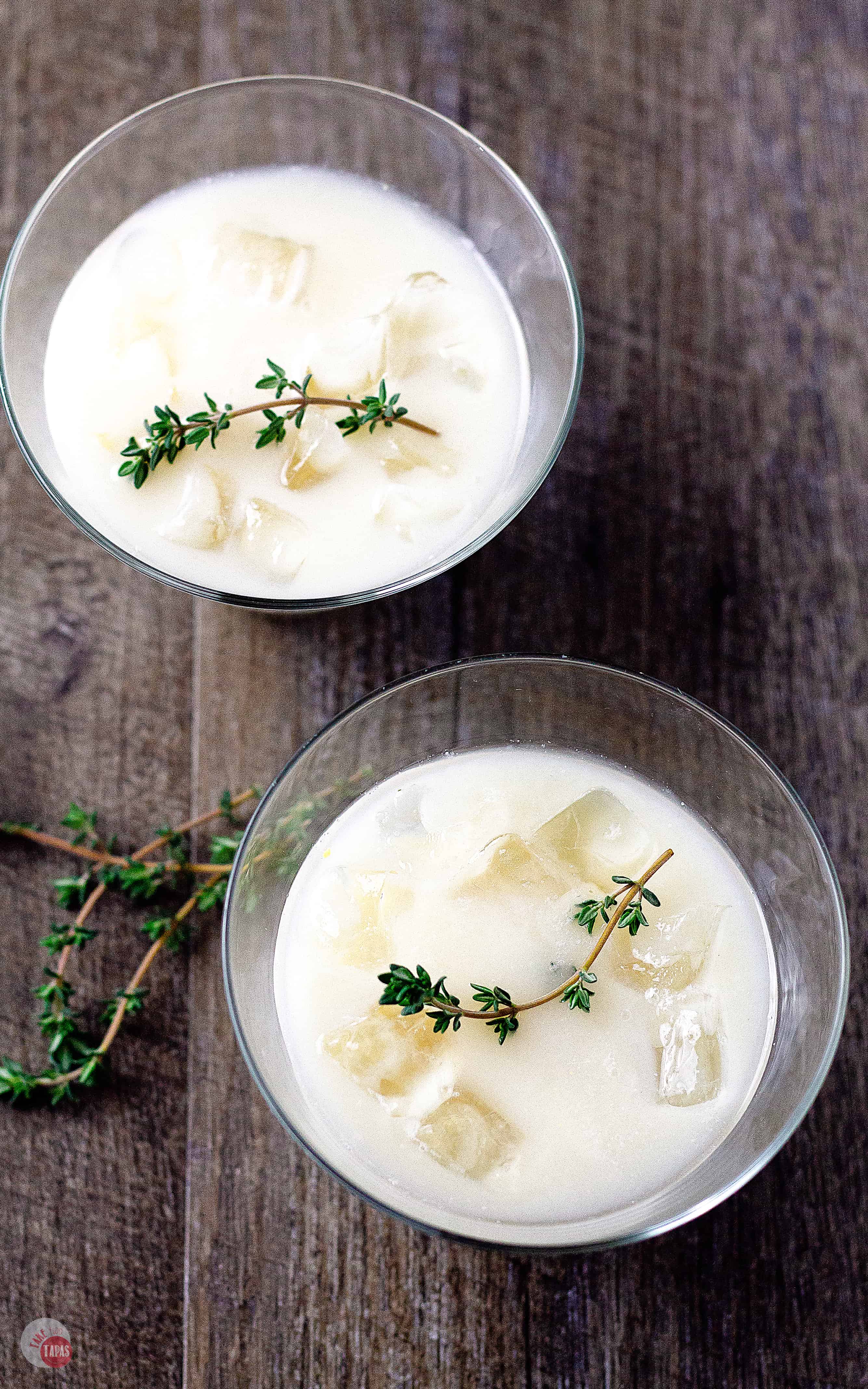 overhead shot of 2 lemon thyme amaretto cocktails