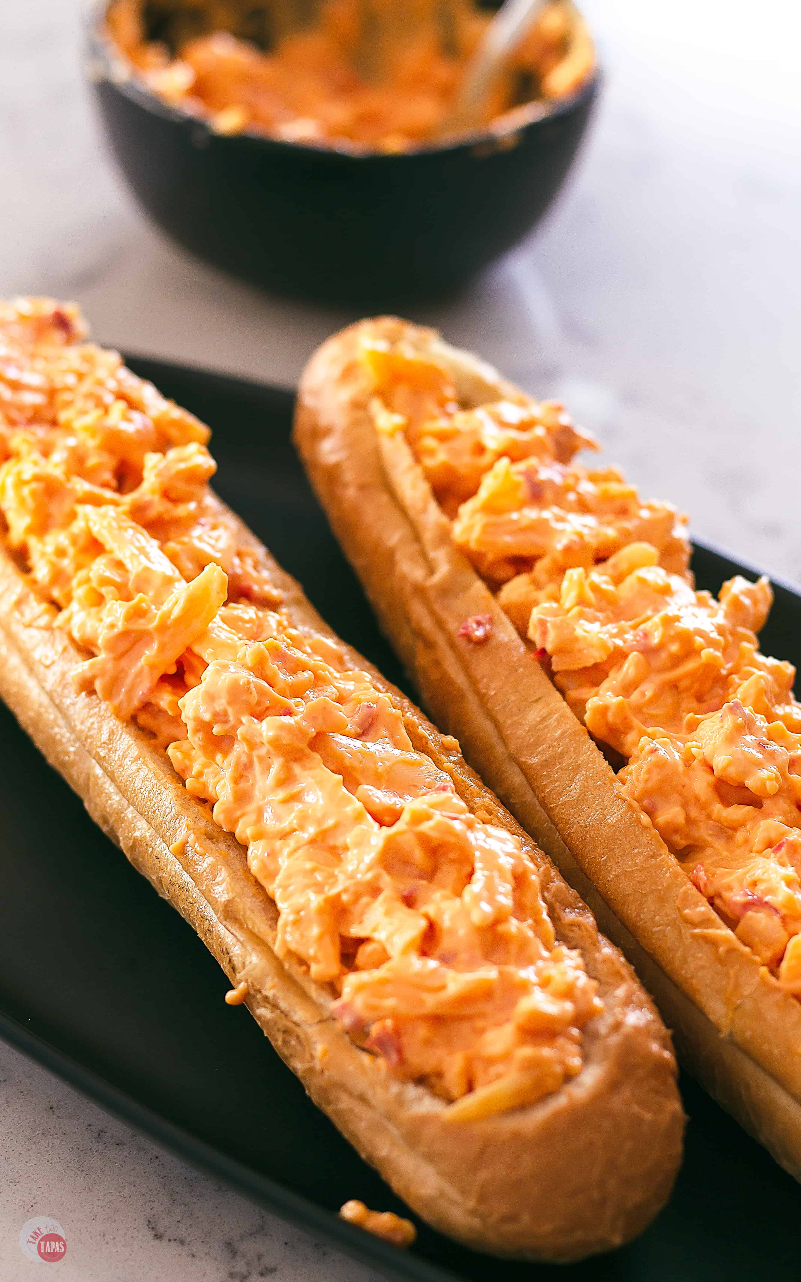 Pimento Cheese stuffed bread on a black platter