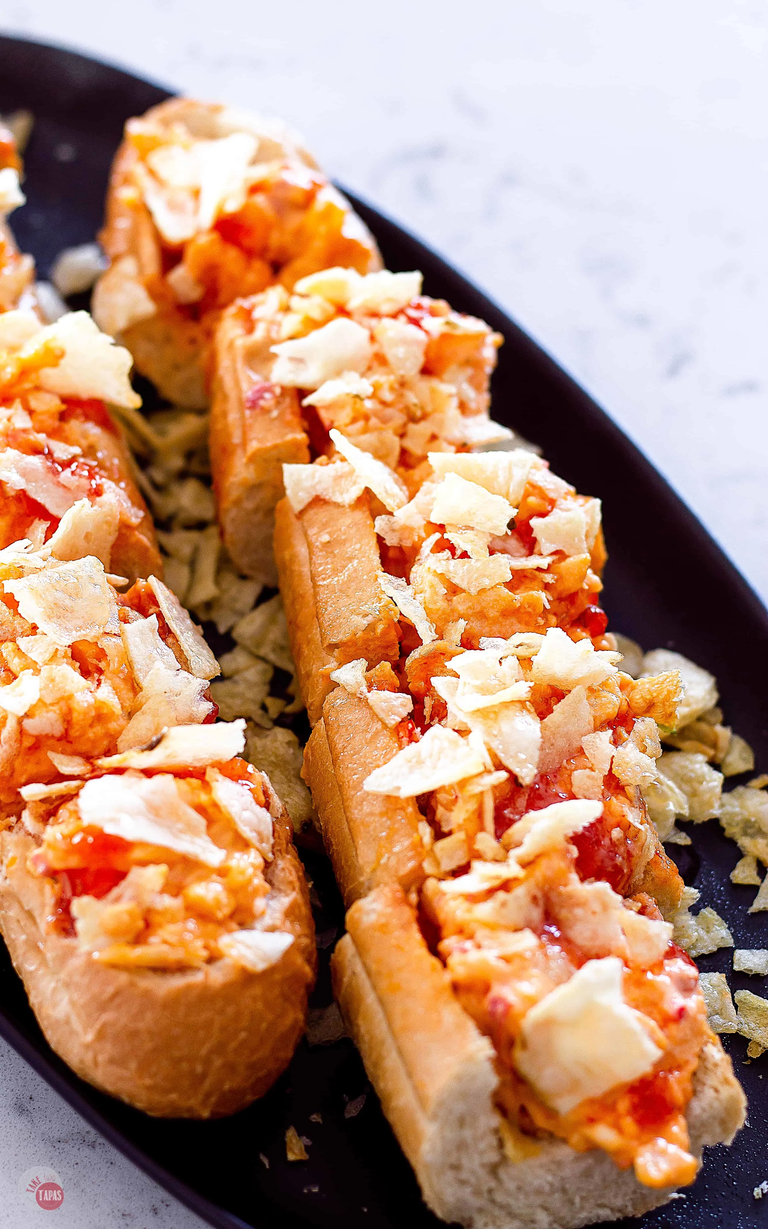 Sweet and Spicy Pimento Cheese Bread Recipe sliced on a dark platter
