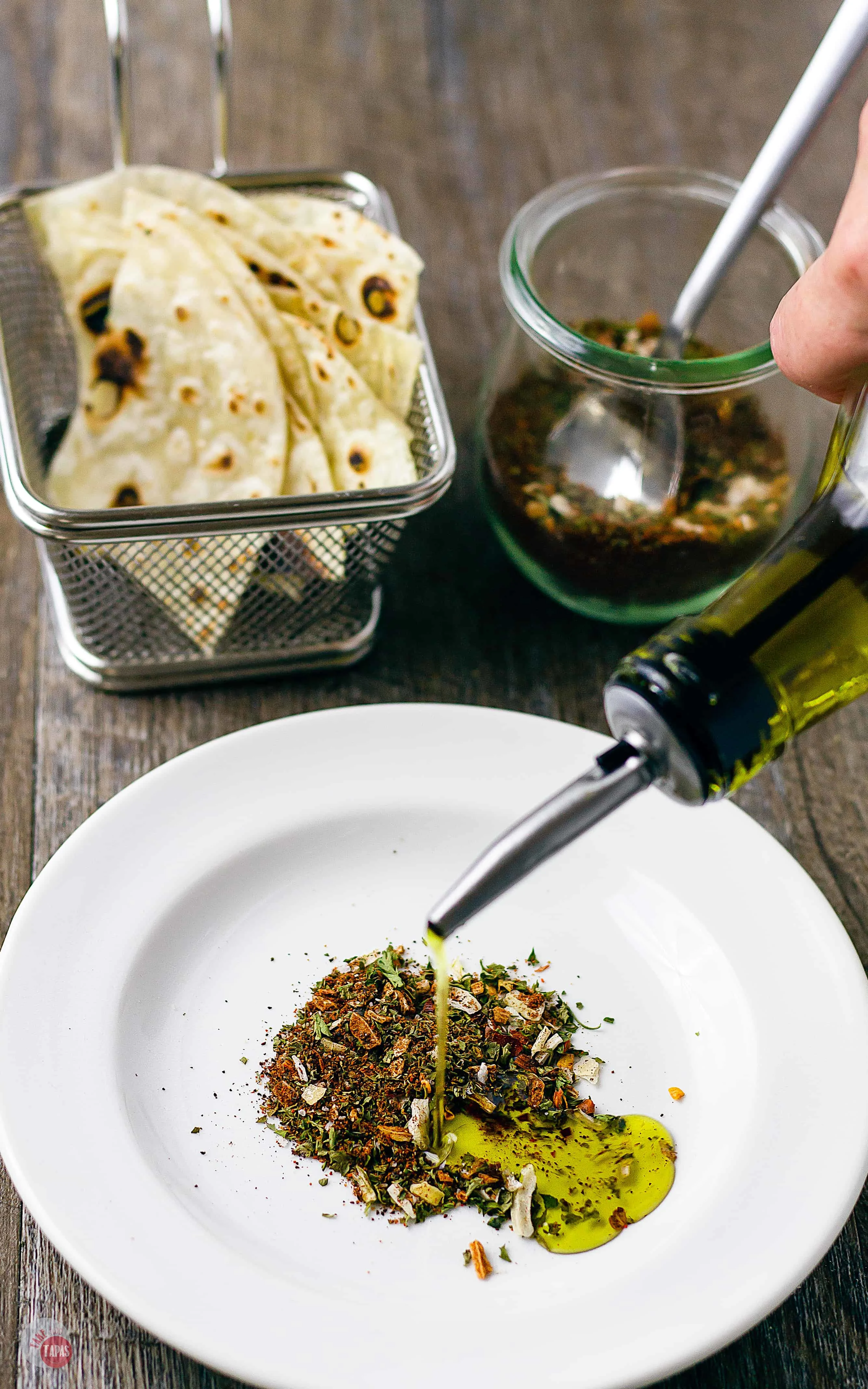 A simple drizzle of oil and a little Southwest Spice make the perfect Southwest Dipping Oil with tortilla | Take Two Tapas | #Southwest #DippingOil #BreadDippingOil #EasyBreadDippingOil #SouthwestSpices