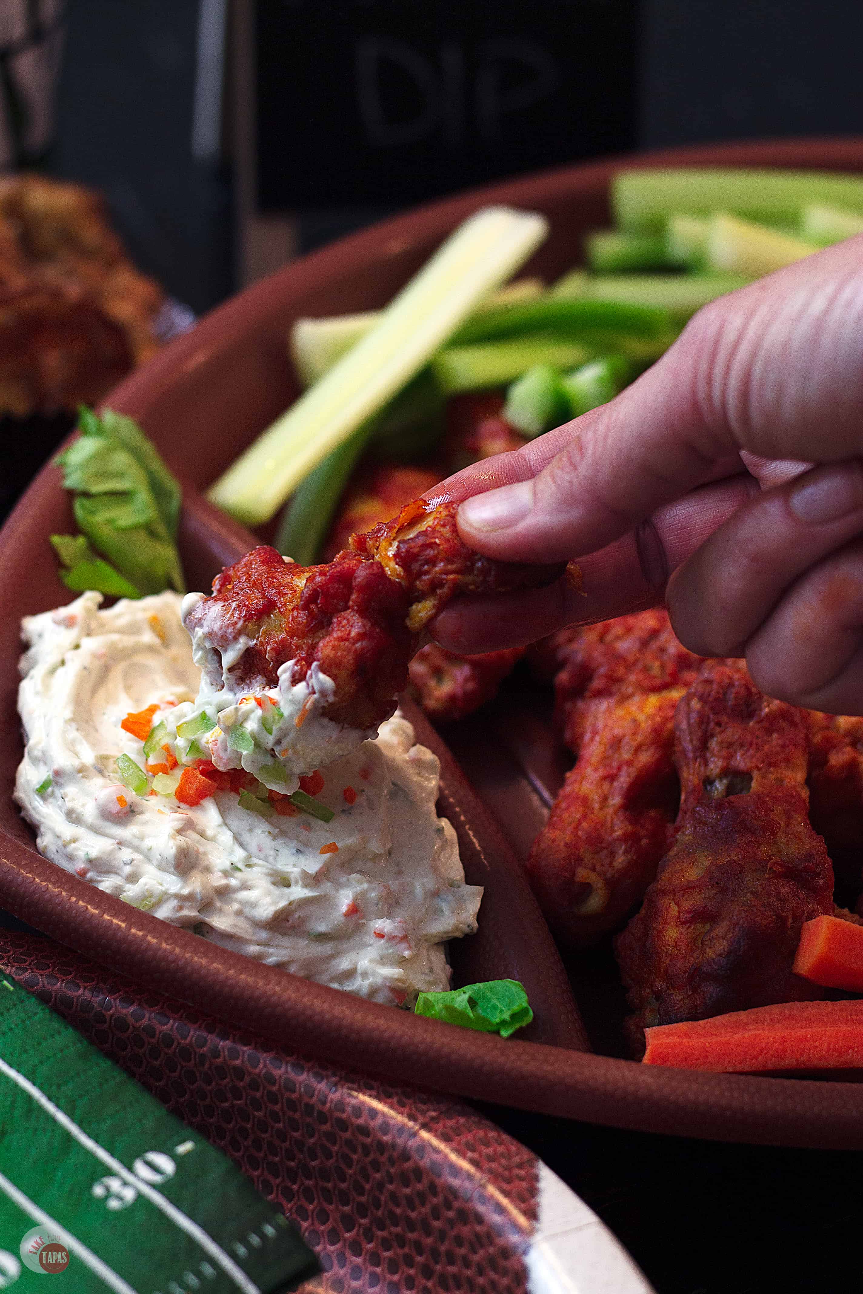 This Blue Ranch Chicken Wing Dip is a combination of the two most popular dips!  Complete with a sprinkling of carrots AND celery, it's perfect for any food! | Take Two Tapas | #ChickenWingDip #BlueCheeseRecipe #RanchDressingRecipe #Tailgating