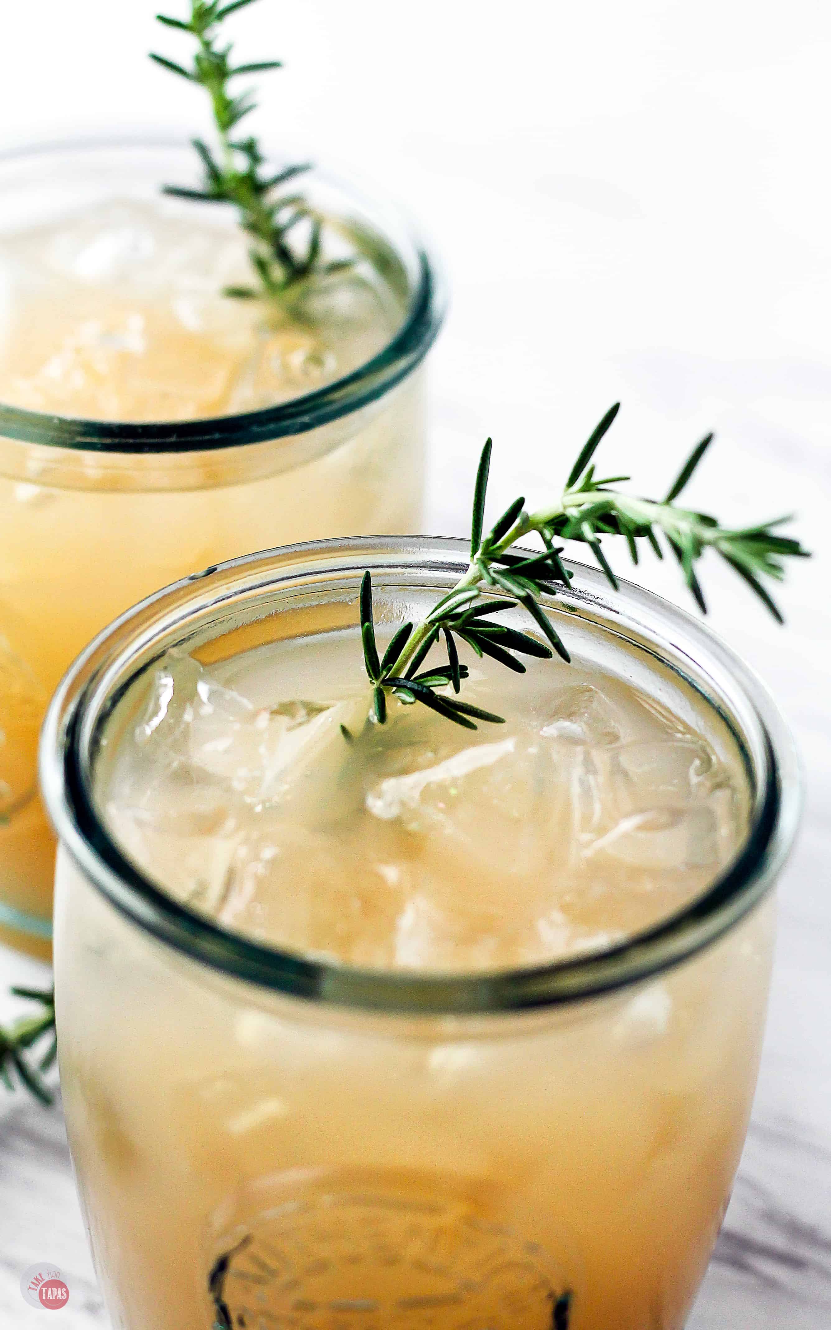 A mixture of herbs and tart grapefruit is the perfect combo for a cocktail! Especially during the holiday season! | Grapefruit Rosemary Rum Punch | Take Two Tapas | #Grapefruit #Rosemary #RumPunch #RumCocktails