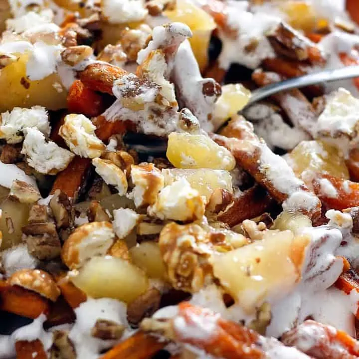 close up of poutine with a fork in it