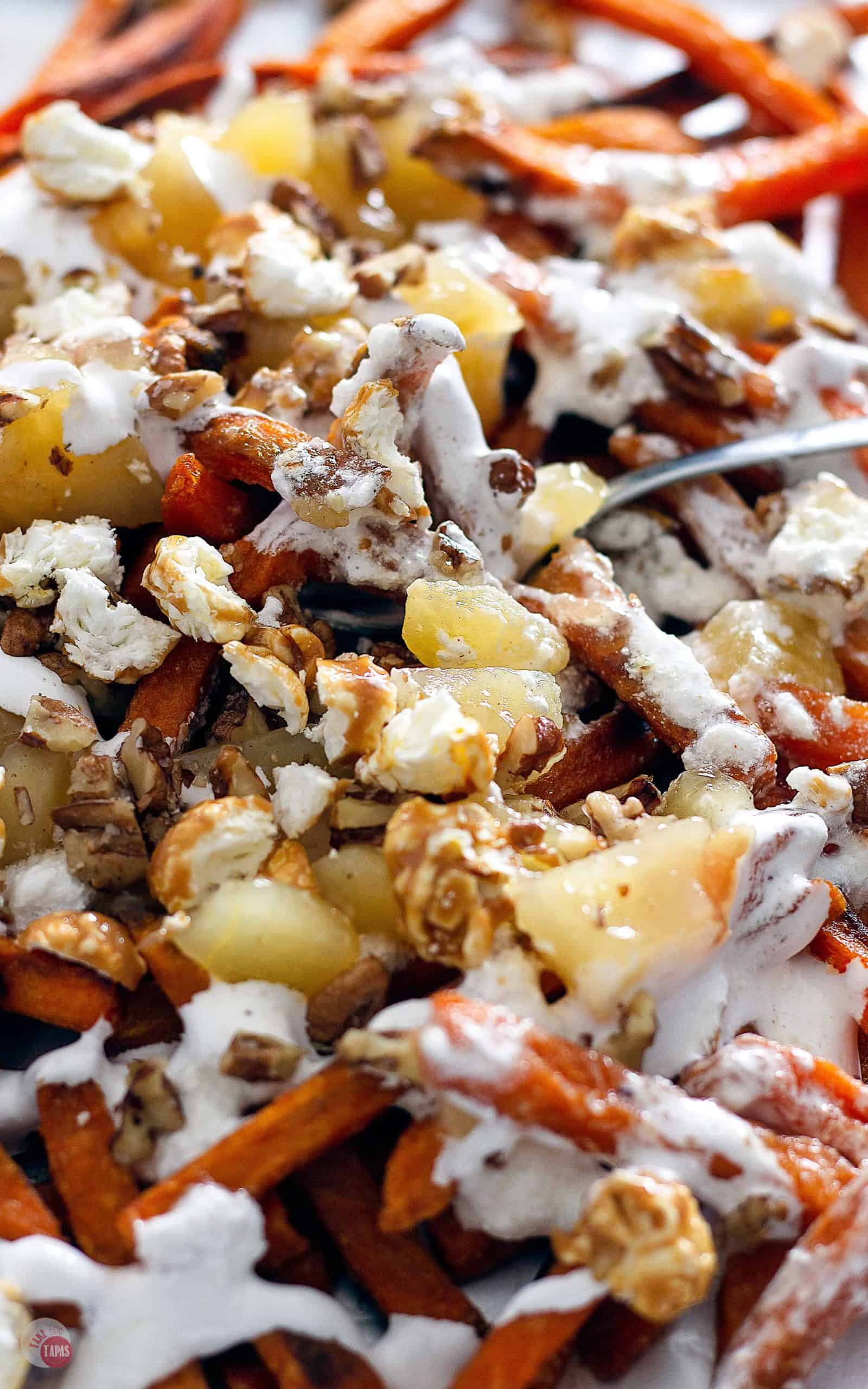 close up of poutine with a fork in it