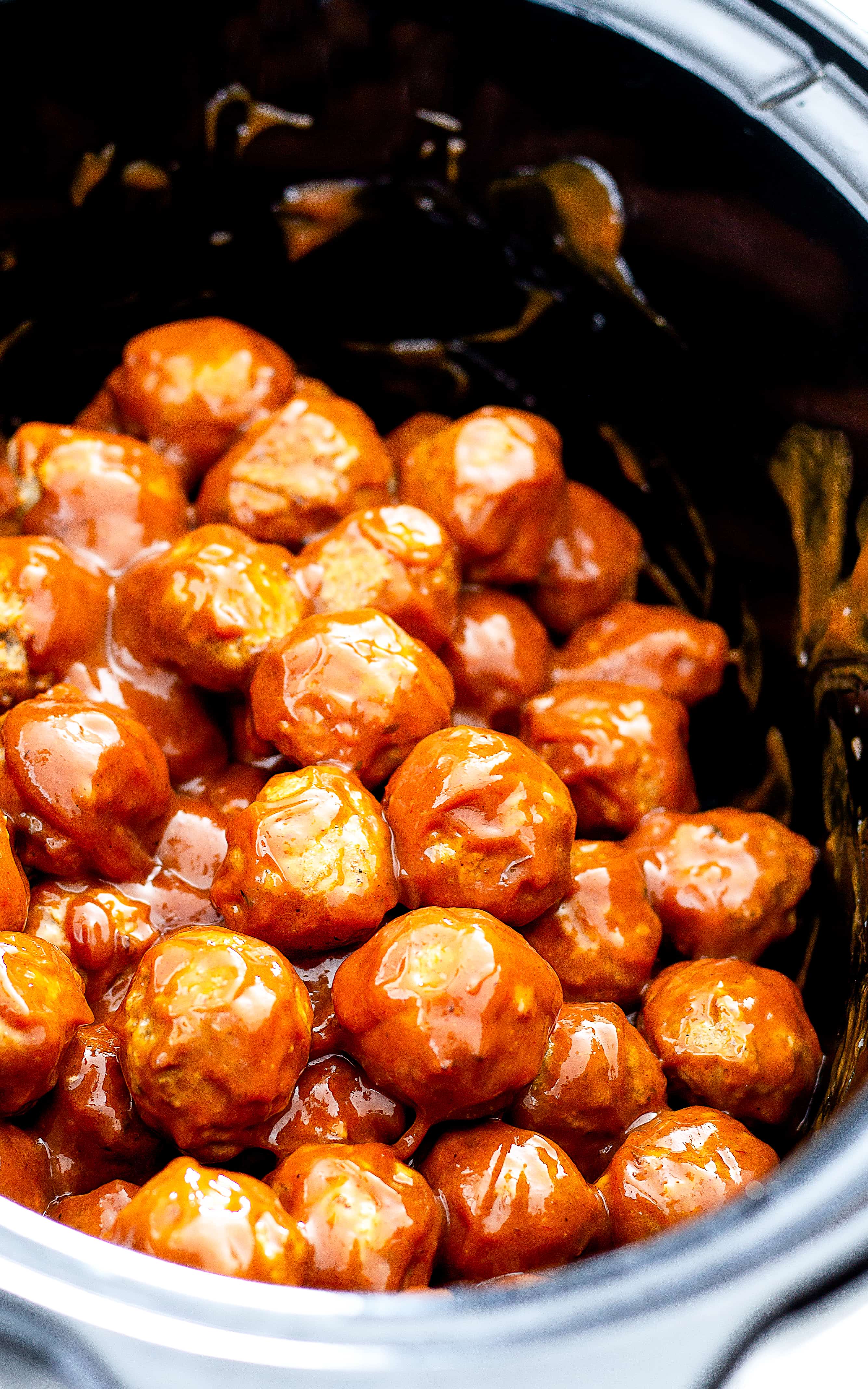 meatballs and sauce in a crockpot bowl