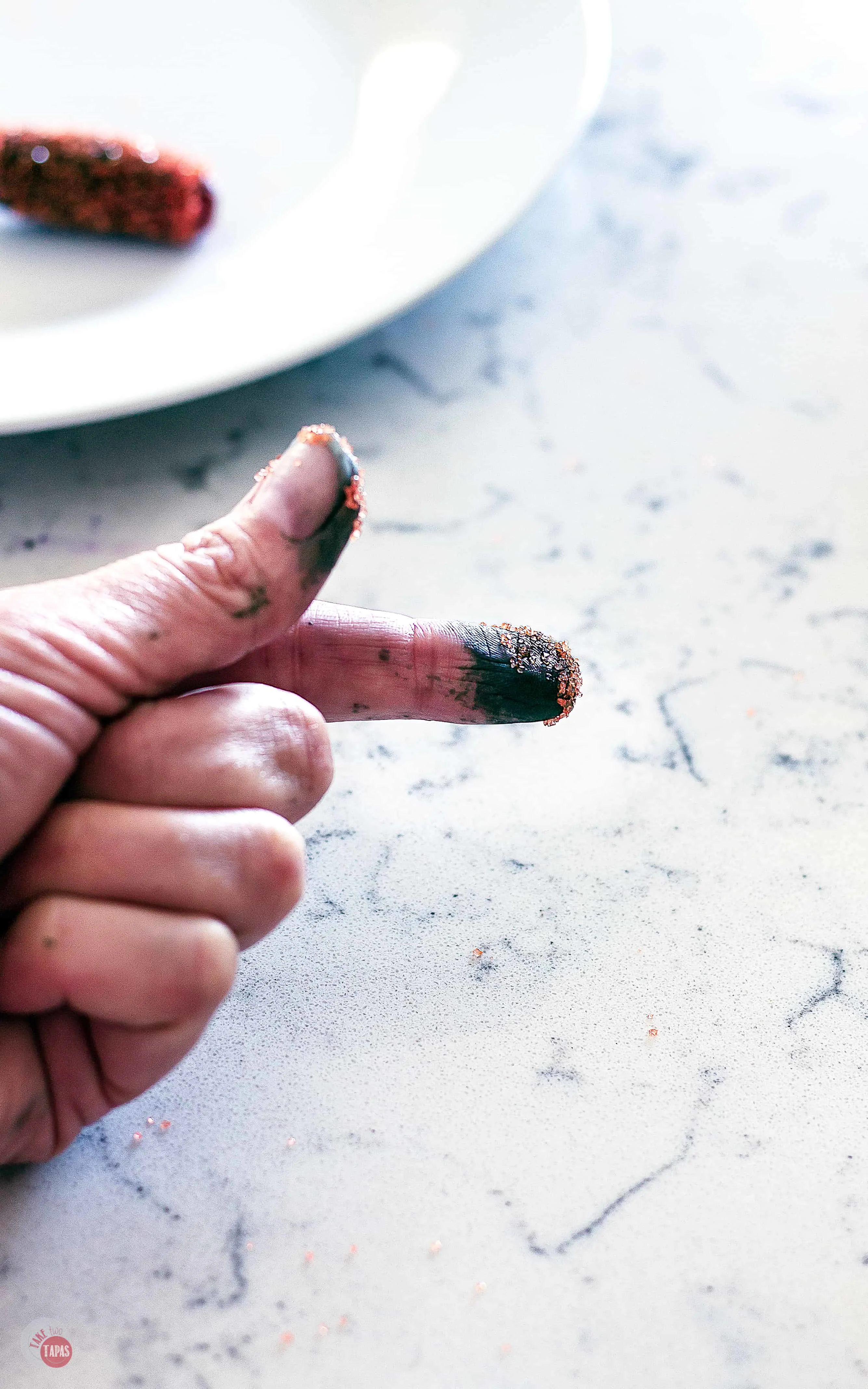You might want to wear gloves when rolling these tequila infused grapes in colored sprinkles and sugar. | Take Two Tapas | #TequilaRecipe #DrunkGrapes #BoozySnacks