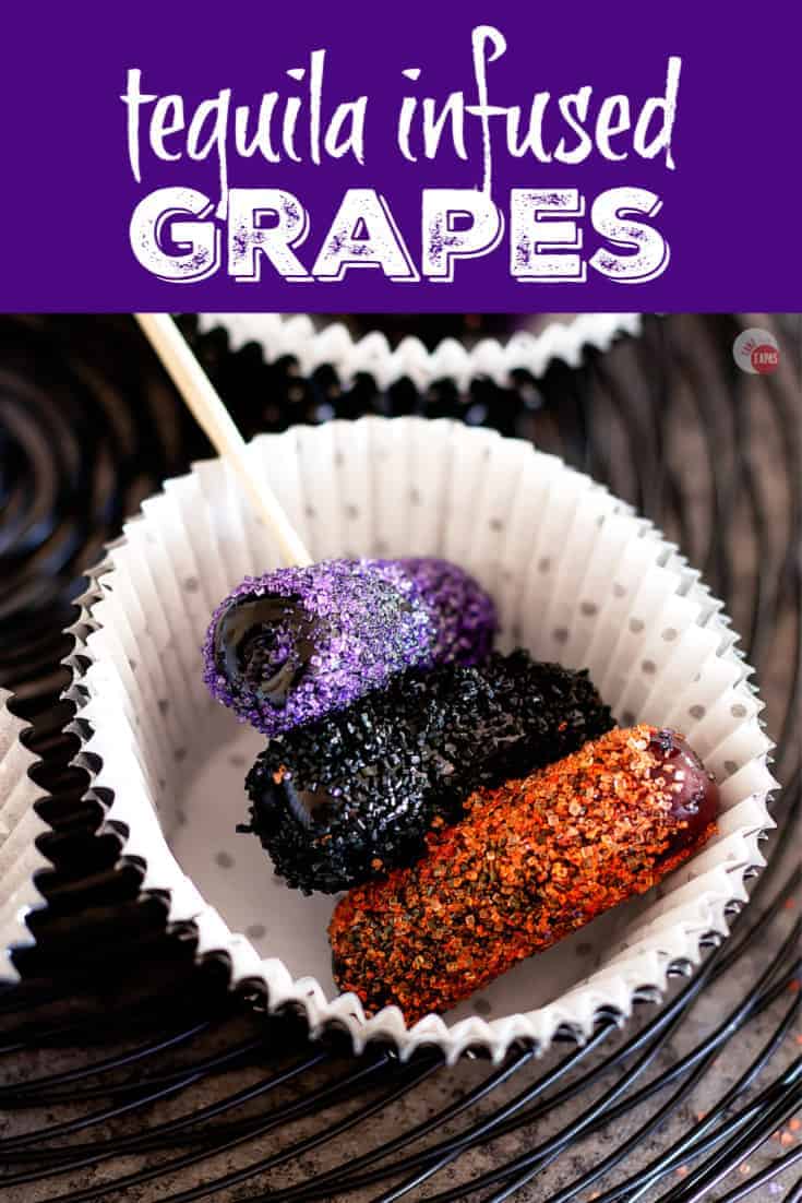 These tequila infused grapes are a sweet and boozy snack that can serve as a dessert too!  Rolled in festive sprinkles and sugar can dress up for any party! | Take Two Tapas | #TequilaRecipe #DrunkGrapes #BoozySnacks