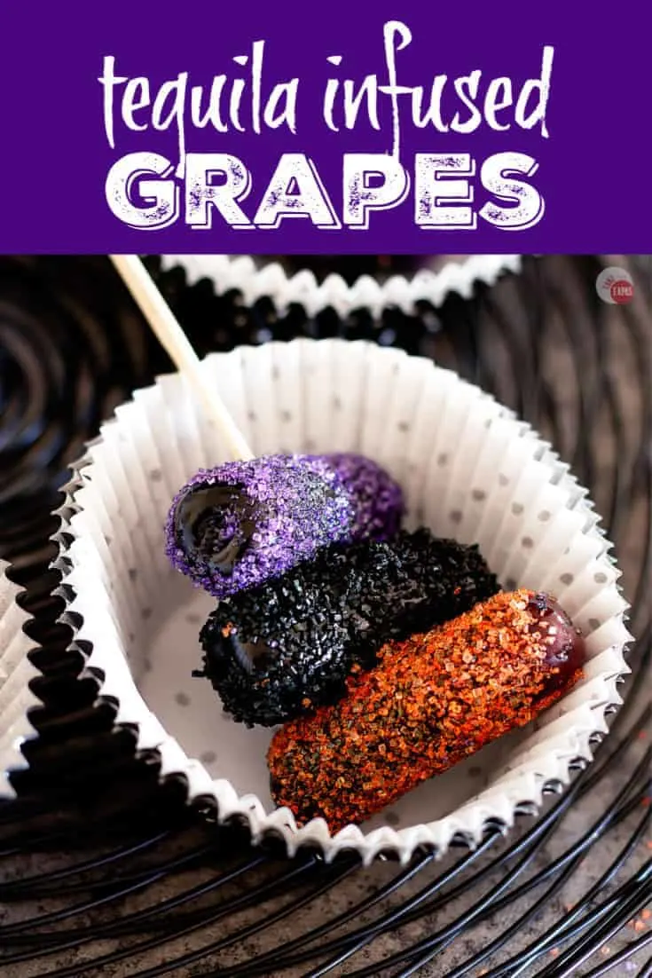 These tequila infused grapes are a sweet and boozy snack that can serve as a dessert too!  Rolled in festive sprinkles and sugar can dress up for any party! | Take Two Tapas | #TequilaRecipe #DrunkGrapes #BoozySnacks