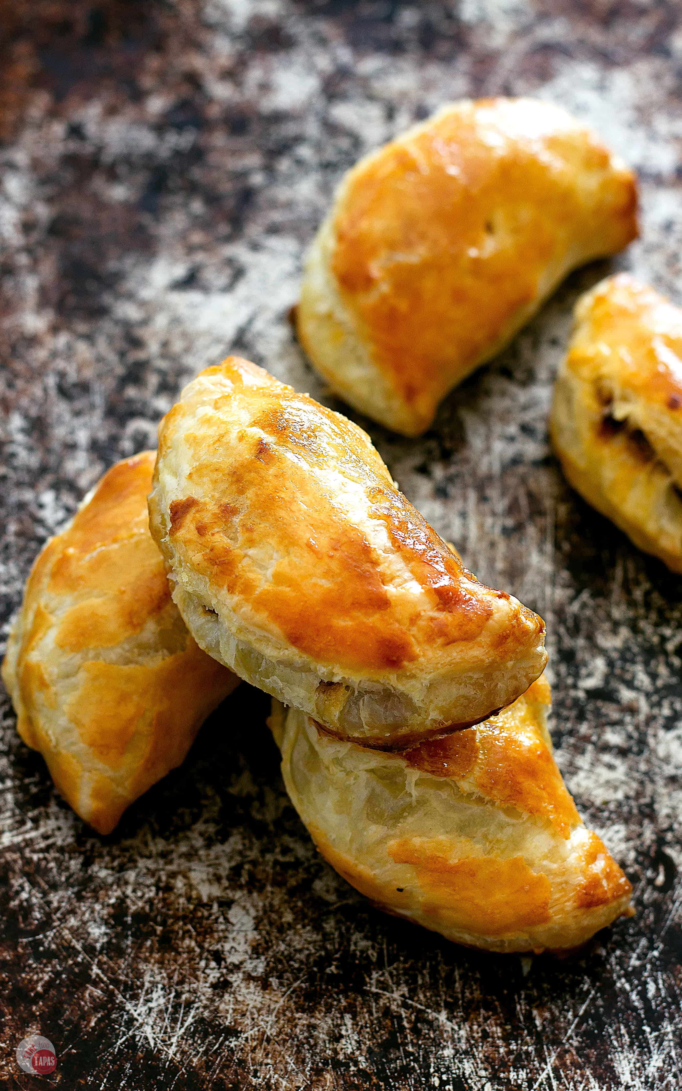 These dark chocolate mole empanadas are full of rich mole sauce and chicken, baked in a fluffy puff pastry shell, and are the perfect appetizer or meal | Take Two Tapas | #MoleRecipe #Empanadas #ad @fortechocolates