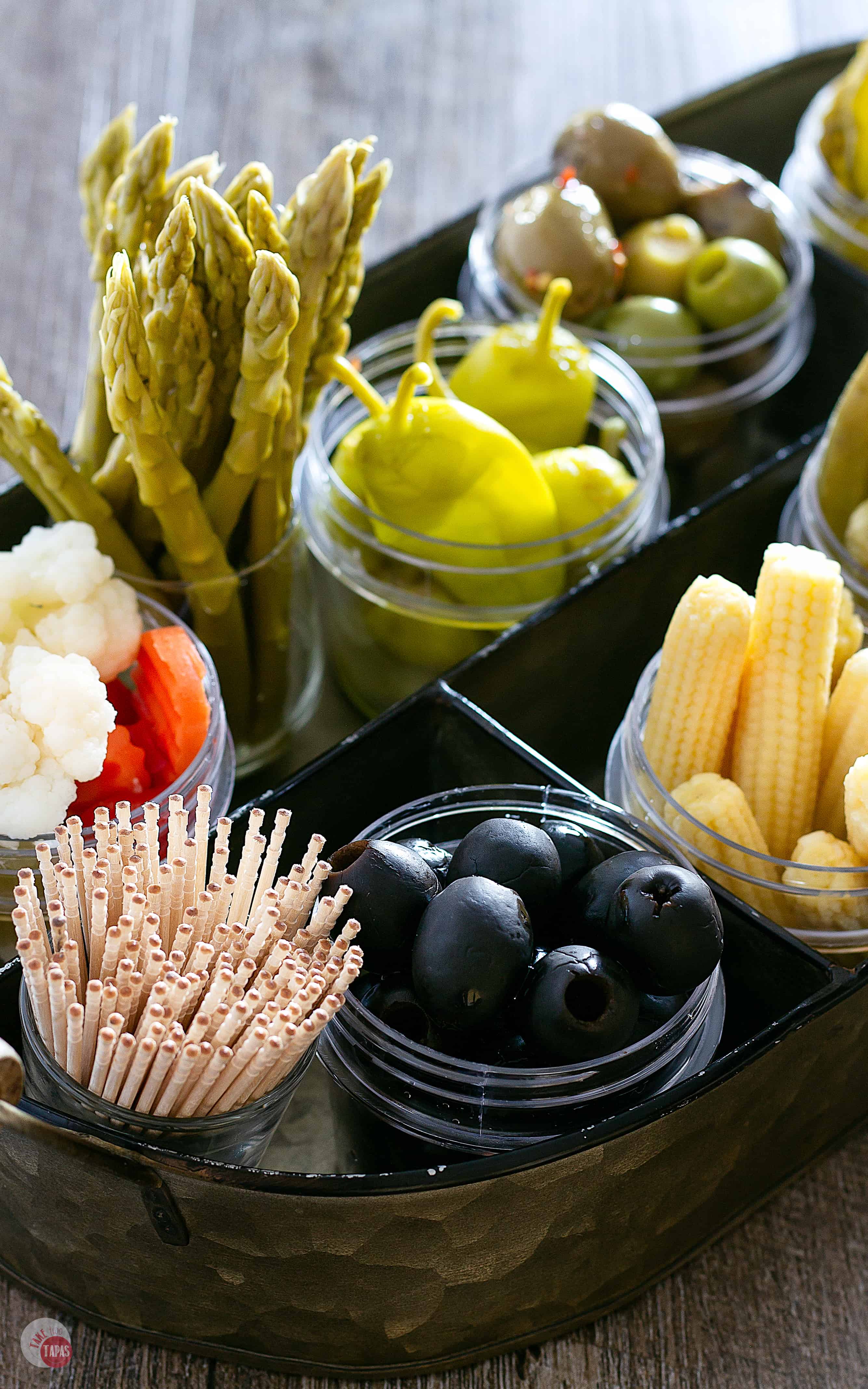 Serve tangy olives and pickled vegetables on a modern relish tray! | Take Two Tapas | #RelishTray #PickledVegetables
