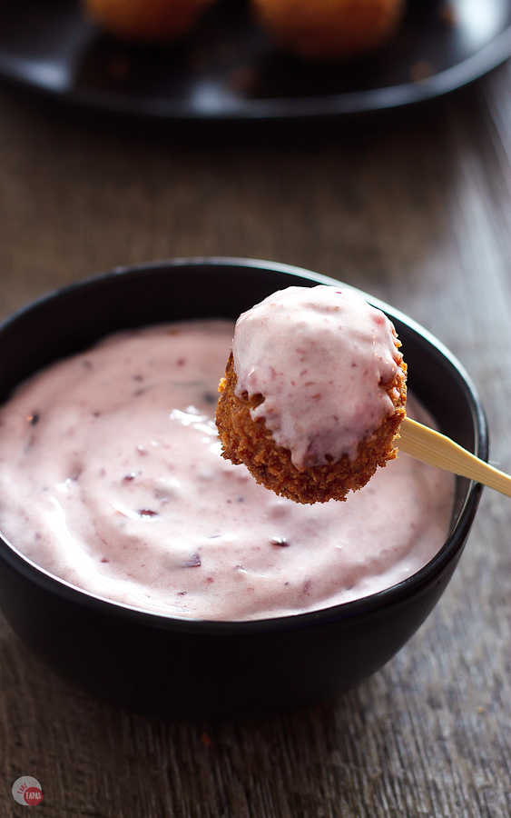 Use leftover cranberry sauce with a little sour cream to make an easy dip for these Fried Cornbread Dressing Balls | Take Two Tapas | #ThanksgivingLeftovers #StuffingRecipe #Appetizer