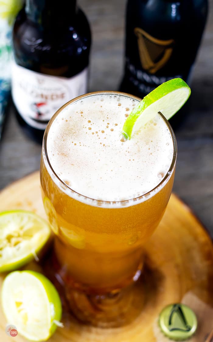 overhead picture of full pint glass with lime wheel