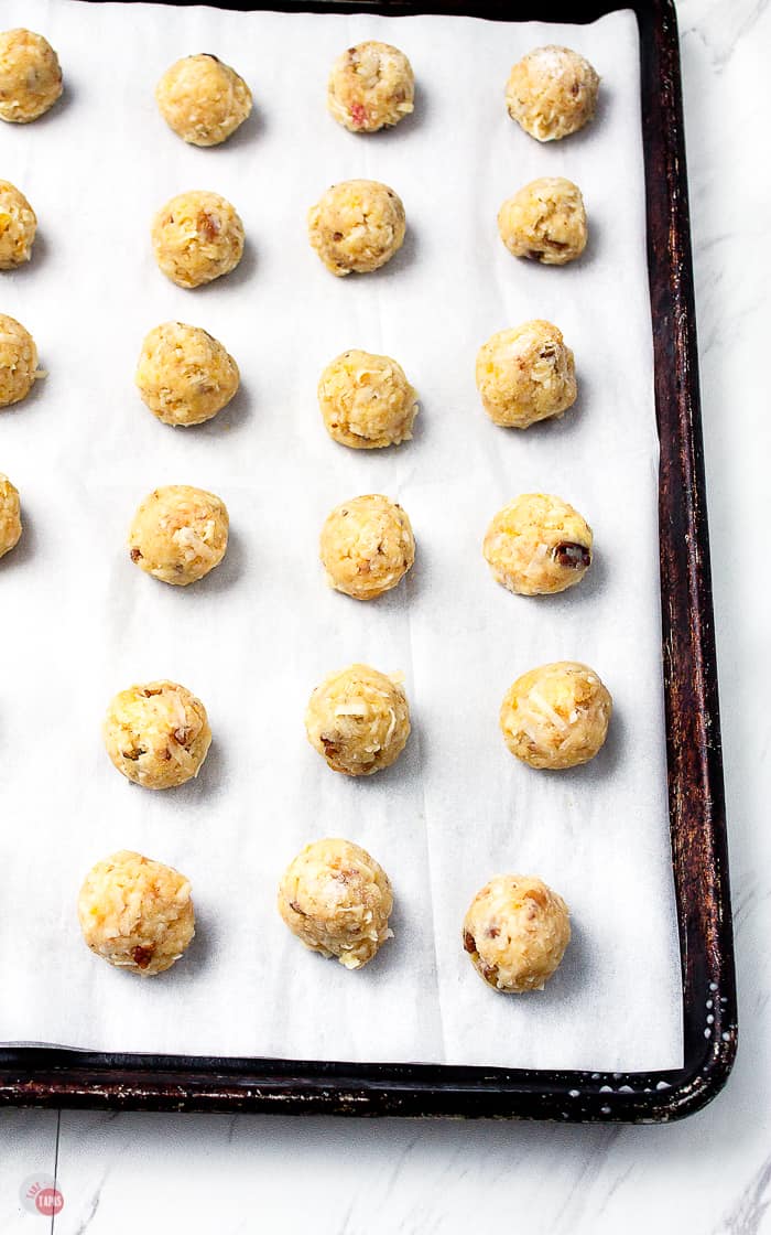Once the fruit cocktail cake and icing have cooled, mix all together and scoop into 1 inch balls | Take Two Tapas | #FruitCocktailCakeBalls #CakeBalls