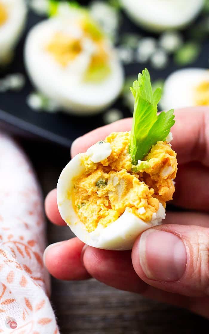 close up of a bite out of a buffalo chicken egg