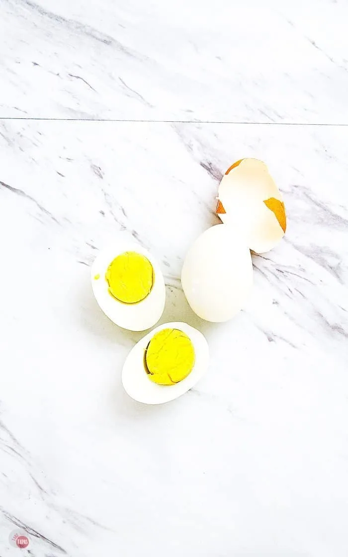 overhead shot of peeled eggs for making hard-boiled eggs