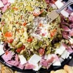 Instead of making a muffuletta sandwich, opt for this delicious muffuletta cheese ball covered in olive salad! #MardiGras #Muffuletta #CheeseBall #PartyFoods