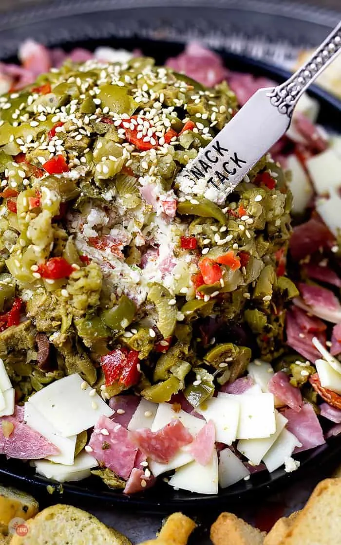 This muffuletta cheese ball is great as an appetizer or a hearty party food at your Mardi Gras party! #MardiGras #Muffuletta #cheeseball