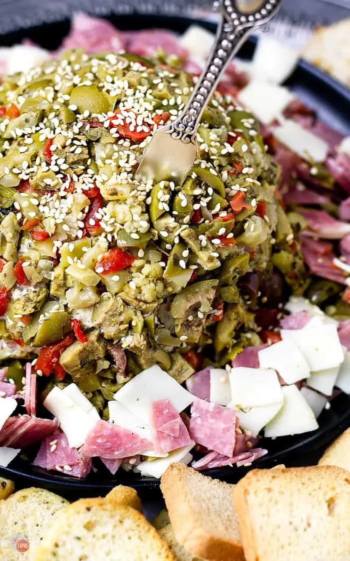 Don't travel to New Orleans to get a Muffuletta, make one at home into a cheeseball! #Muffuletta #cheeseball #NewOrleans