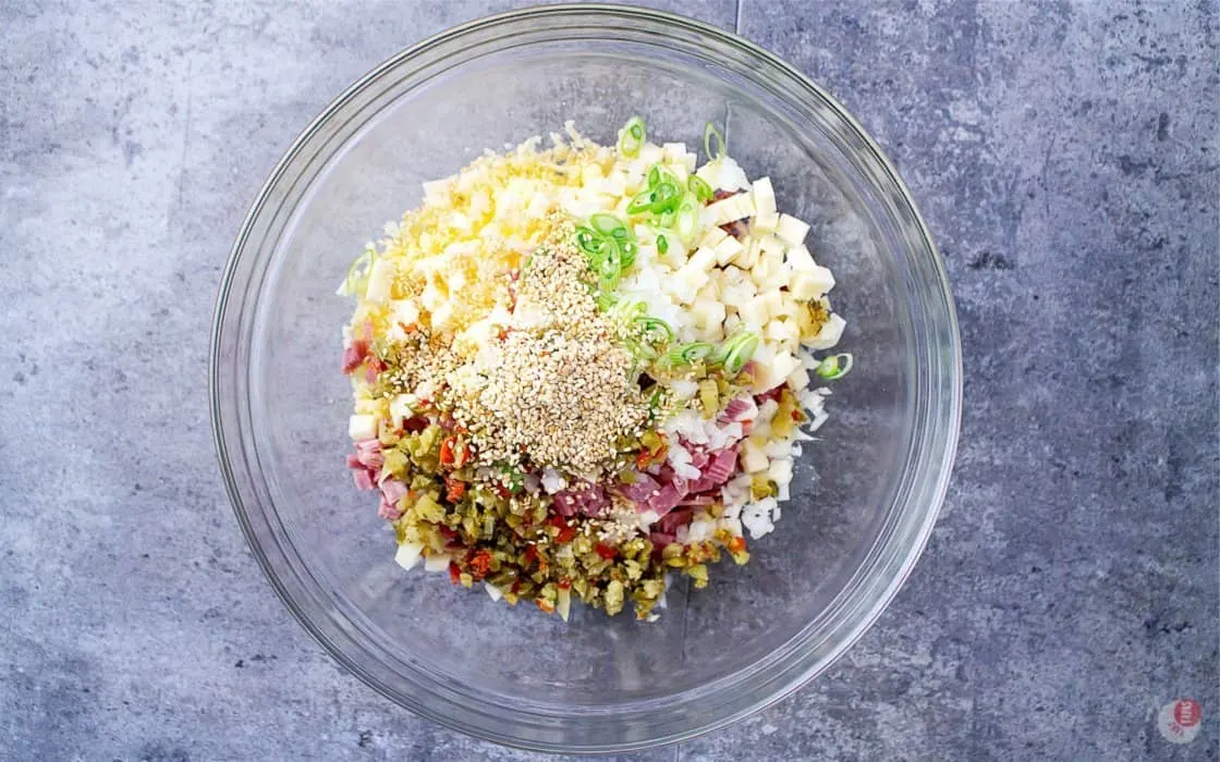 the ingredients to a muffuletta sandwich with some cream cheese and you have the perfect cheese ball! #Muffuletta #cheeseball #Appetizer