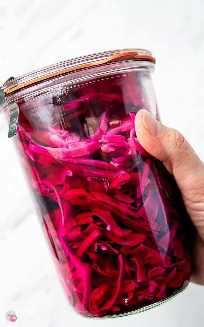 a side view of a jar of pickled purple cabbage