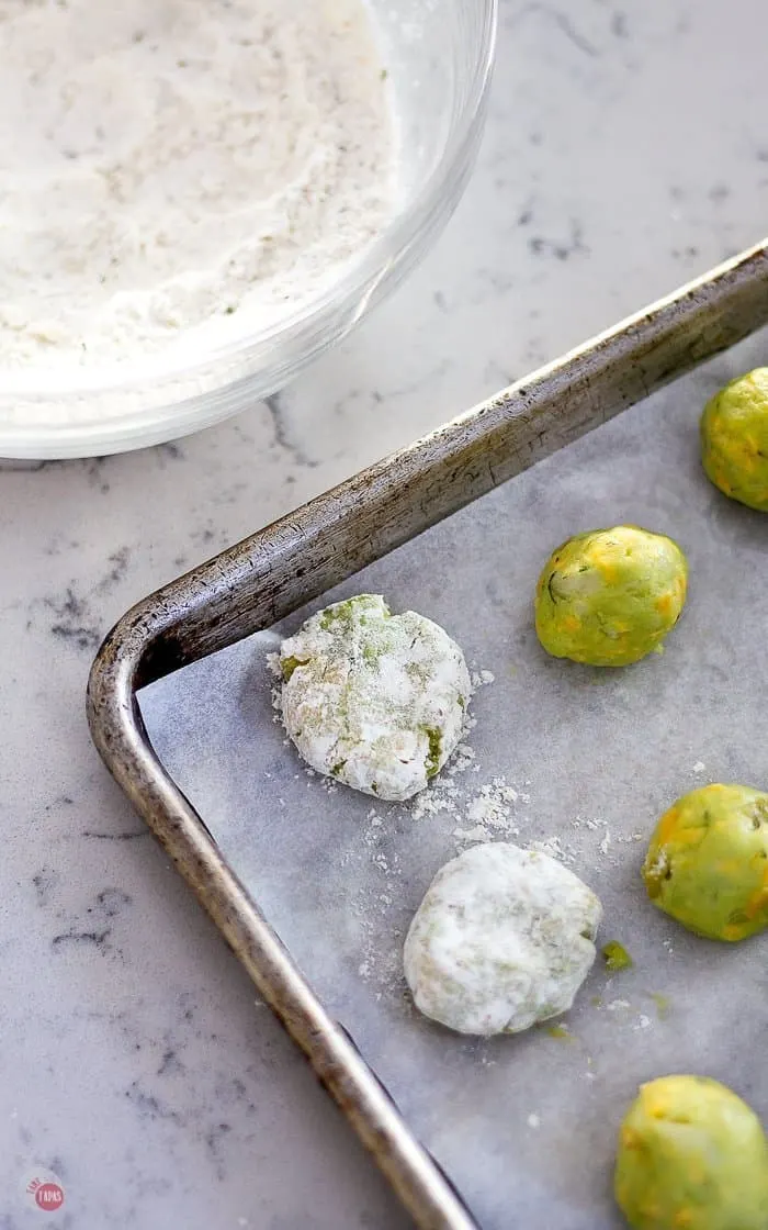 A simple dusting in flour gives these Taco Tater Tots a crispy brown coating #TaterTots #potatotots #potatorecipe