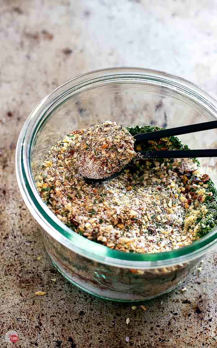 open jar of all purpose steak seasoning partially stirred