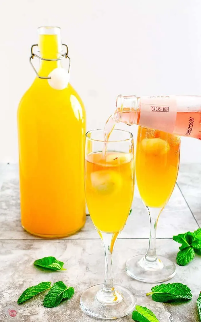 pouring Rosé Hard Cider into the cider mimosa
