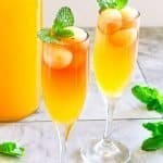 side angle of cider mimosa in champagne flute