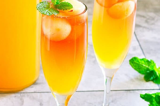 side angle of cider mimosa in champagne flute
